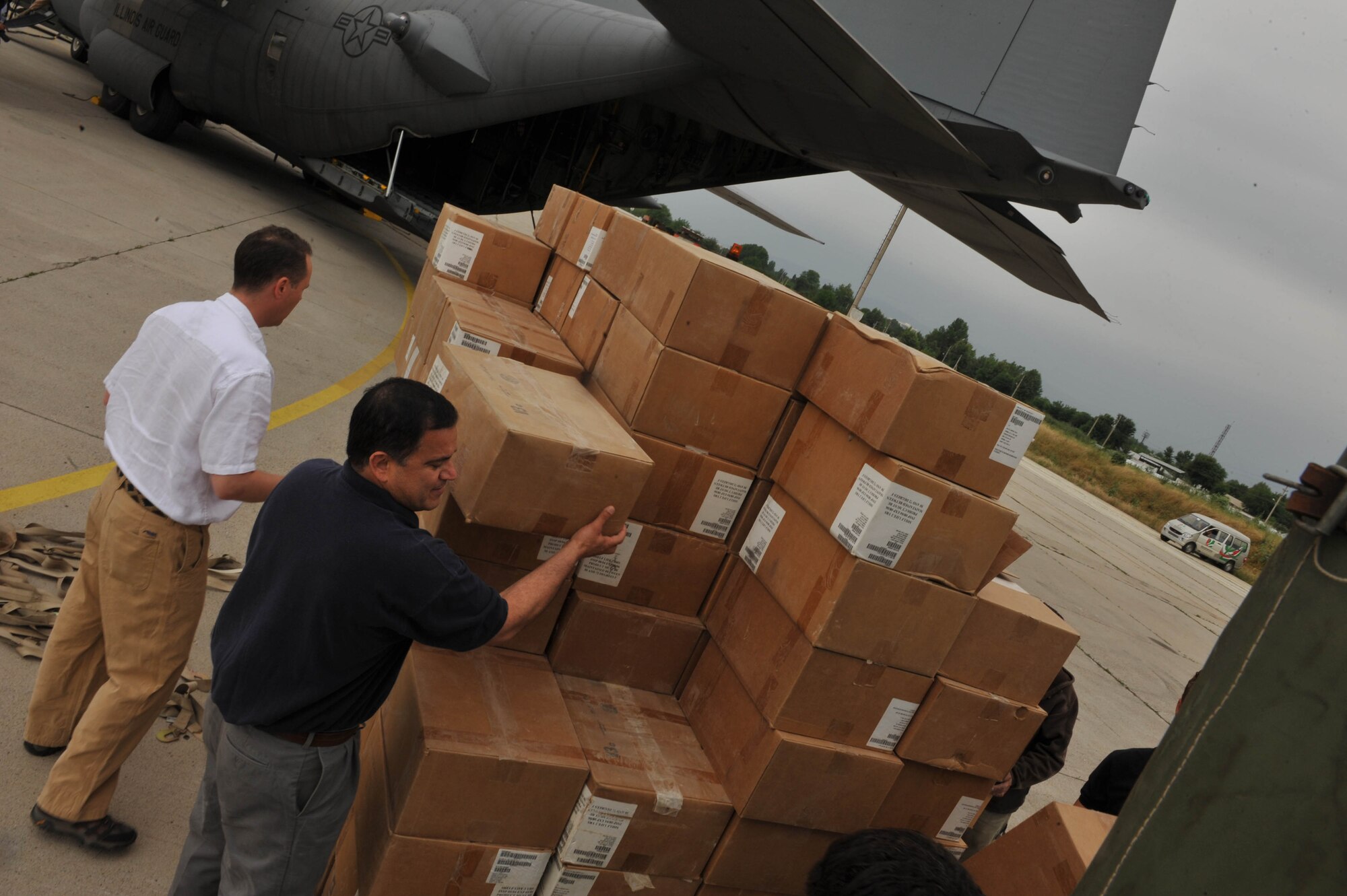 Workers load boxes of medical supplies, hygiene kits and water onto a truck at Dushanbe International Airport, Tajikistan, May 21, 2010. The humanitarian cargo is in support of Tajiks displaced from their homes after floods and mudslides ravaged the Kulyab District.  (U.S. Air Force photo/Staff Sgt. Quinton Russ/released)