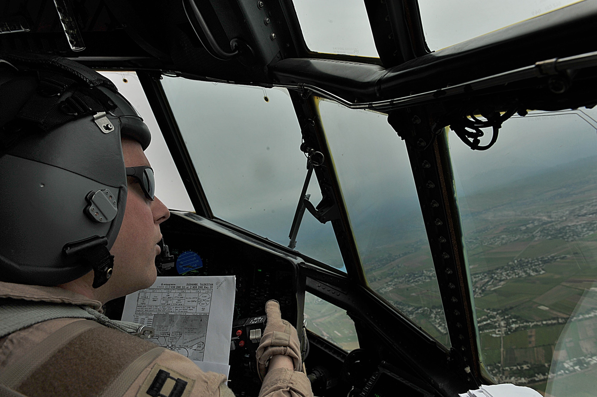 U.S. Air Force pilot, Capt. Jon Deck, flies a C-130 Hercules carrying humanitarian aid for displaced Tajiks into Dushanbe International Airport, Tajikistan, May 21, 2010.  Captain Deck is deployed to the 774th Expeditionary Airlift Squadron, Bagram Airfield, Afghanistan.  (U.S. Air Force photo/Staff Sgt. Quinton Russ/released)