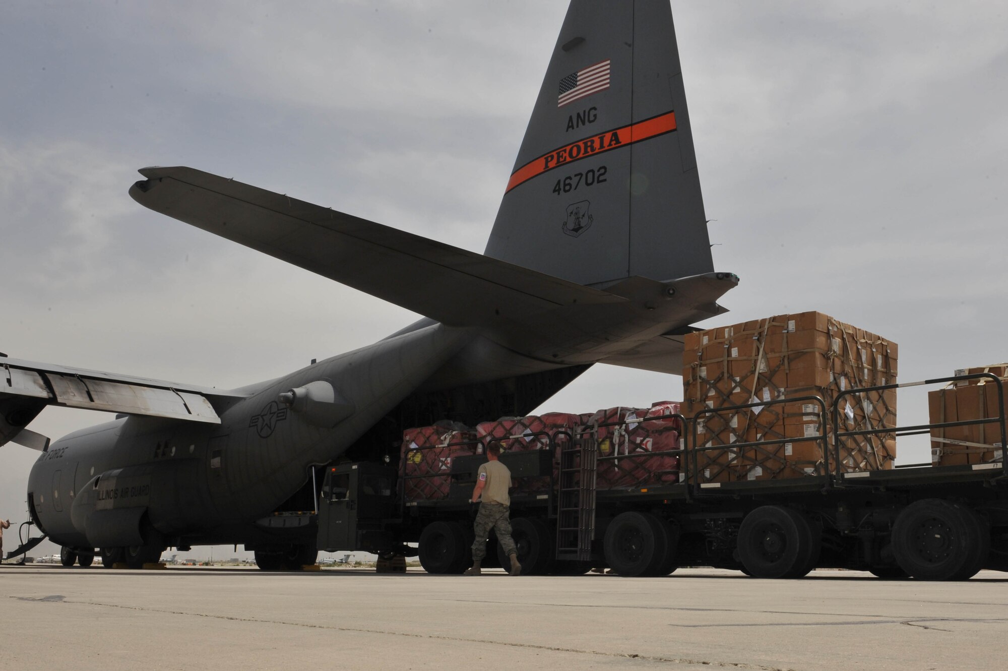 A C-130 Hercules is loaded with medical supplies, hygiene kits and water in support of flood relief efforts for the people of Tajikistan at Bagram Airfield, Afghanistan, May 21, 2010.   (U.S. Air Force photo/Staff Sgt. Quinton Russ/released)
