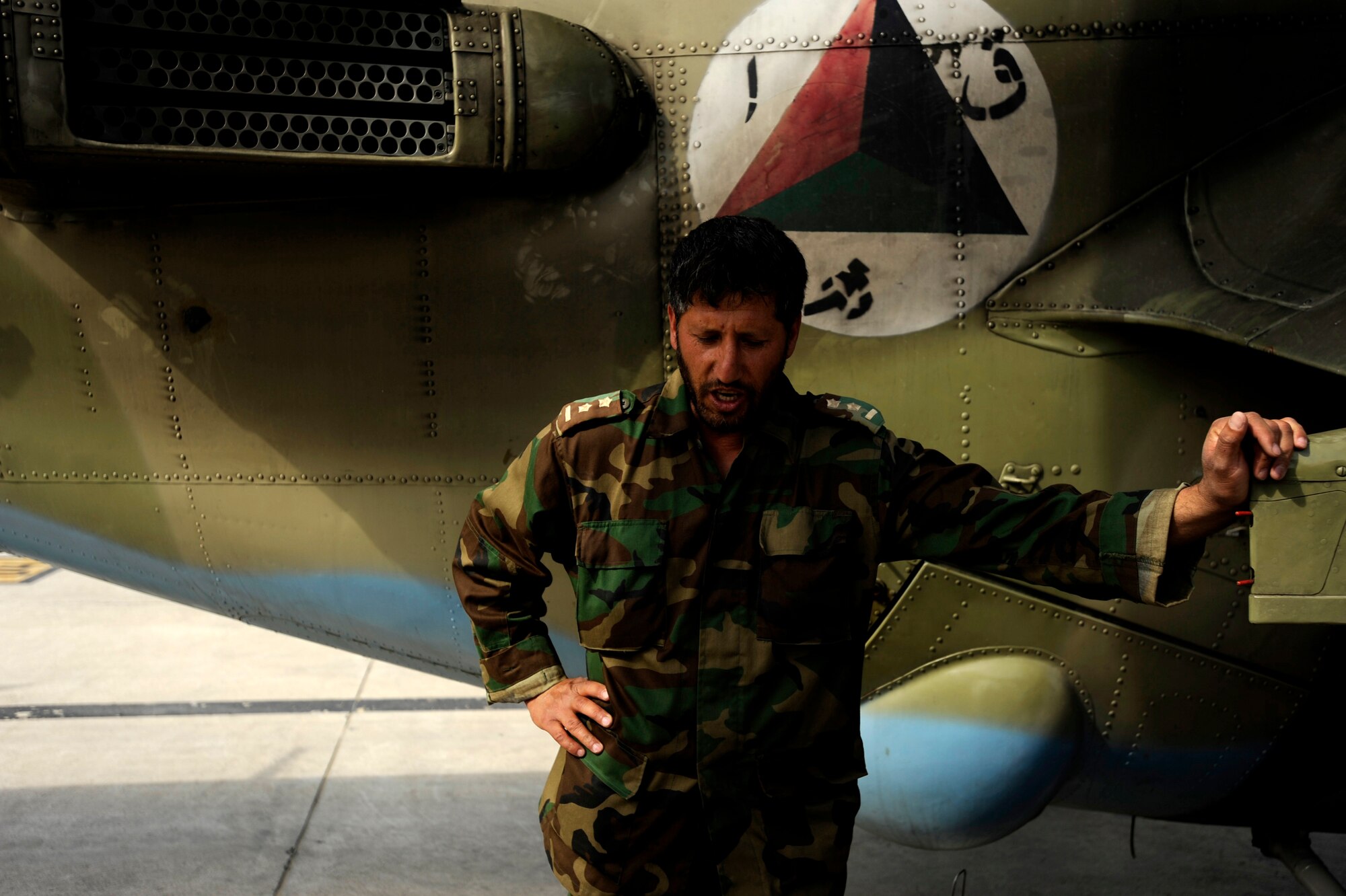 Afghan National Army Air Corps Capt. Hadayat Ullah, technical officer, waits for the arrival of S-S KP long-guided rockets to reload an Mi-35 HIND E after returning from a live-fire training mission May 11, 2010, at Kabul International Airport, Afghanistan. (U.S. Air Force photo/ Staff Sgt. Manuel J. Martinez/released)