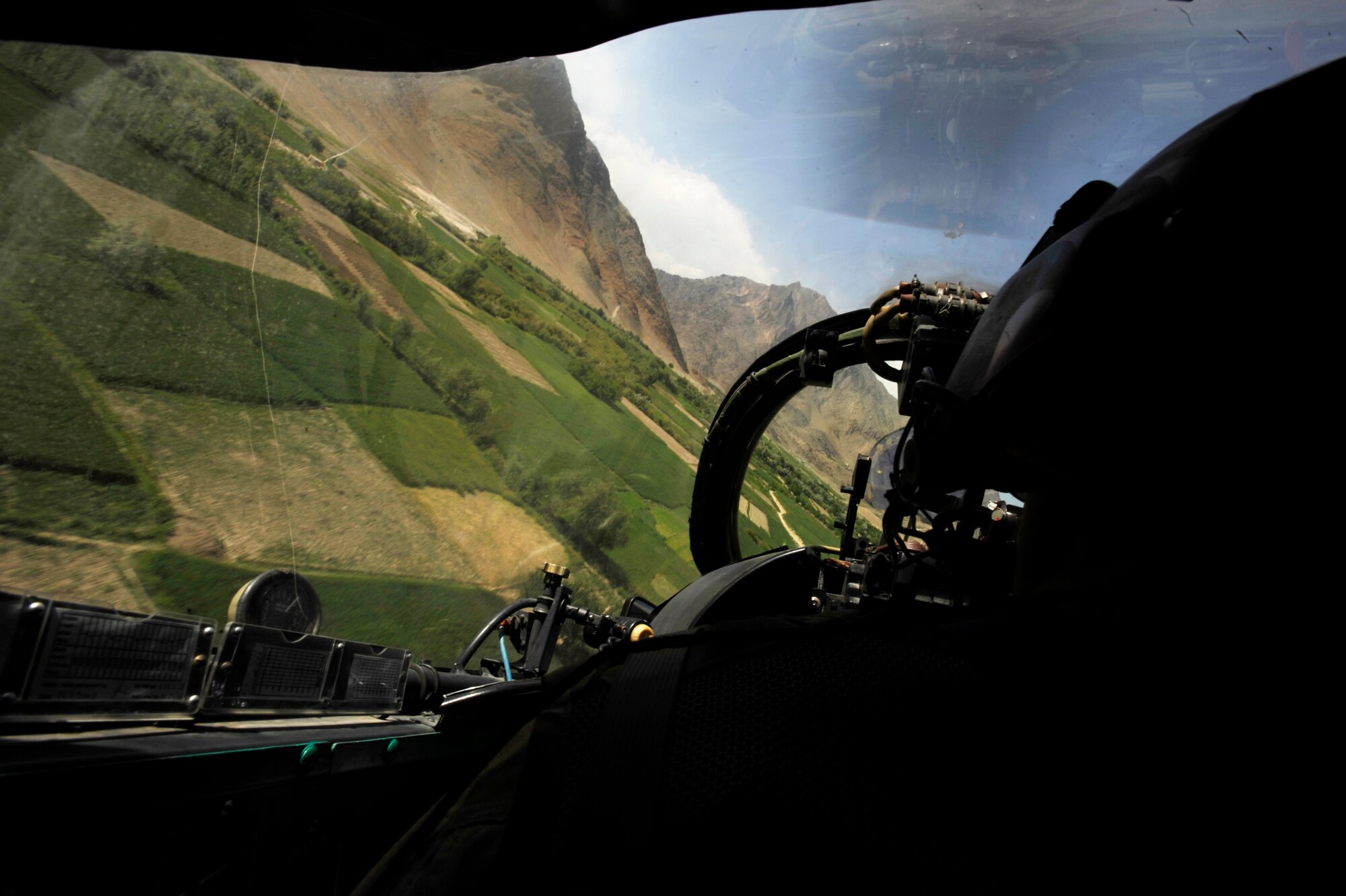 Maj. Caleb Nimmo, Mi-35 team lead assigned to the 440th Air Expeditionary Advisor Squadron, and Hungarian Air Force Maj. Szili ''Alex'' Sandor, an Mi-35 Hind E instructor pilot assigned to the Hungarian Operational Mentoring Team, fly back to Kabul International Airport after a training mission May 11, 2010, flying over Afghanistan (U.S. Air Force photo/ Staff Sgt. Manuel J. Martinez/released)
