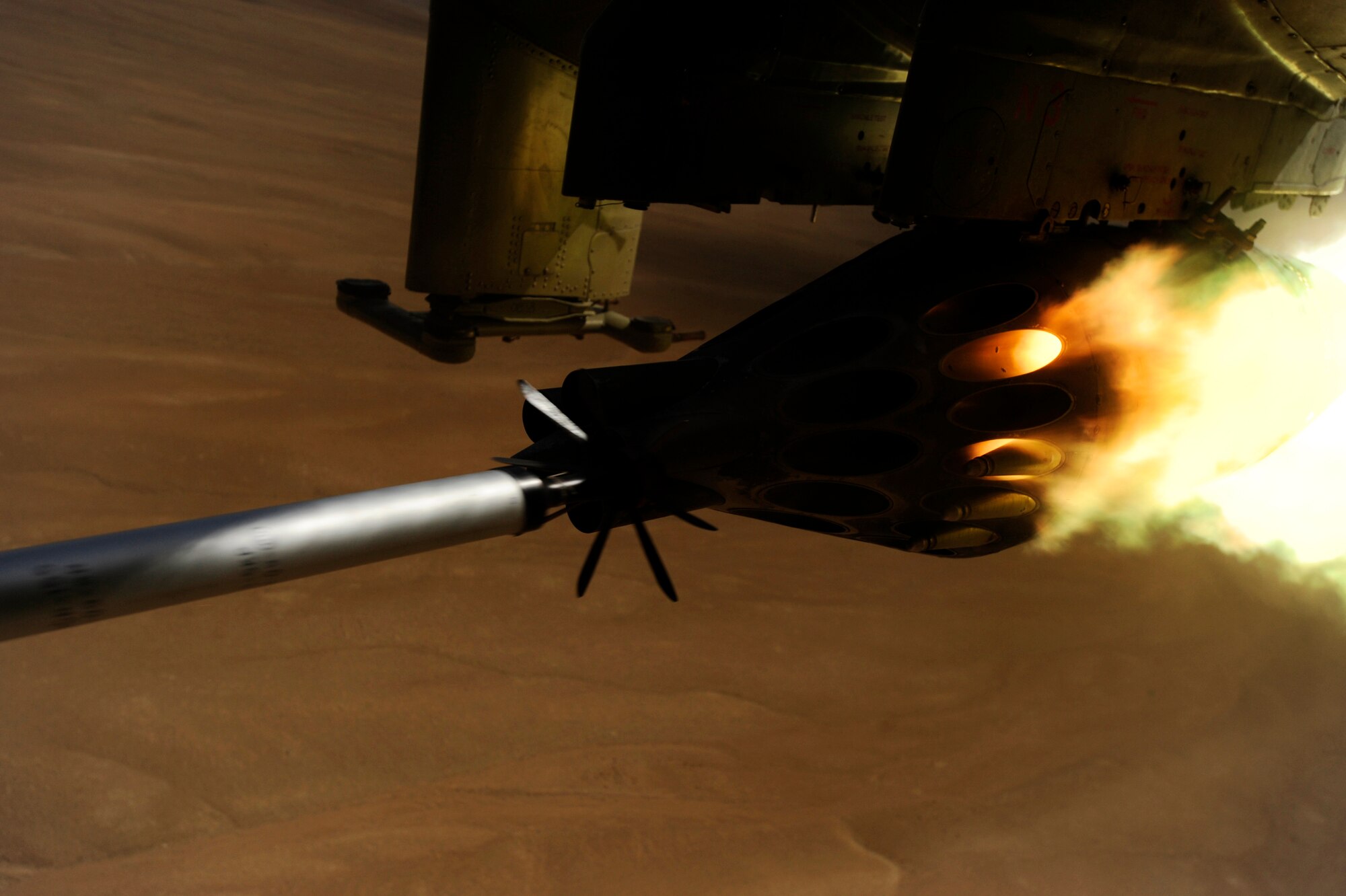 A KP long-guided rocket launches from the rocket pod of an Afghan National Army Air Corps Mi-35 attack helicopter May 11, 2010, over the Forward Operating Base Shank firing range.  U.S. Air Force Maj. Caleb Nimmo, Mi-35 team lead assigned to the 440th Air Expeditionary Advisor Squadron, and Hungarian Air Force Maj. Szili ''Alex'' Sandor, an Mi-35 Hind E instructor pilot assigned to the Hungarian Operational Mentoring Team, fired the rocket from their aircraft during a live-fire exercise. The front of the heavily armored helicopter is fitted with a 12.7 mm Yak-B Gatling gun and can carry up to four 57 mm rocket pods for a total payload of 256 anti-tank rockets. Often called a "flying tank," the helicopter is durable, powerful and well-suited for the temperature and terrain of Afghanistan. (U.S. Air Force photo/ Staff Sgt. Manuel J. Martinez/released)

