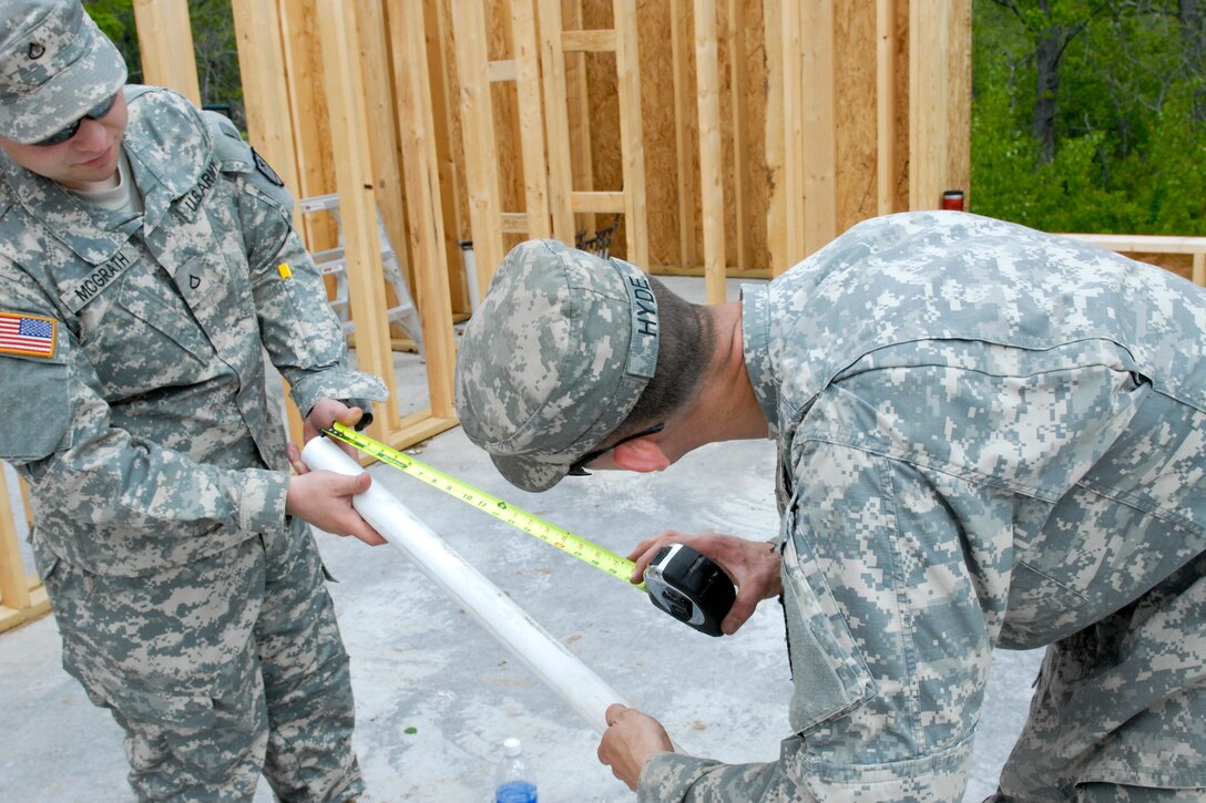 U.S. Army Pfc. Bryan McGrath, left, and Sgt. Jeffrey Hyde are spending