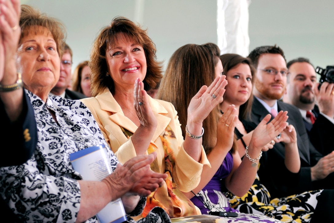 Linda Papp and family and friends applaud as U.S. Coast Guard Adm. Robert J. Papp Jr. addresses the audience during the U.S. Coast Guard Change of Command Ceremony on Fort Lesley J. McNair in Washington, D.C.,May 25, 2010. 