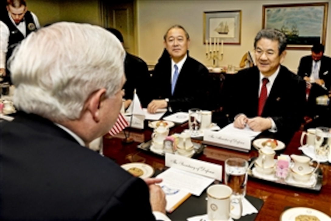 Japan's Minister of Defense Toshimi Kitazawa, right, meets with U.S. Defense Secretary Robert M. Gates, left foreground, to discuss a range of bilateral security issues at the Pentagon, May 25, 2010. Japan's Ambassador to the United States Ichiro Fujisaki, center, joined Kitazawa.