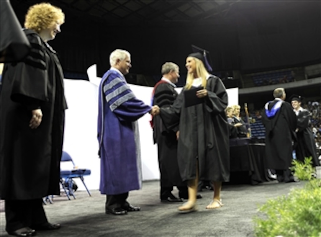 Secretary of Defense Robert M. Gates congratulates graduates of Blue Valley Northwest High School during their graduation ceremony at Kemper Arena in Kansas City, Mo., on May 23, 2010.  