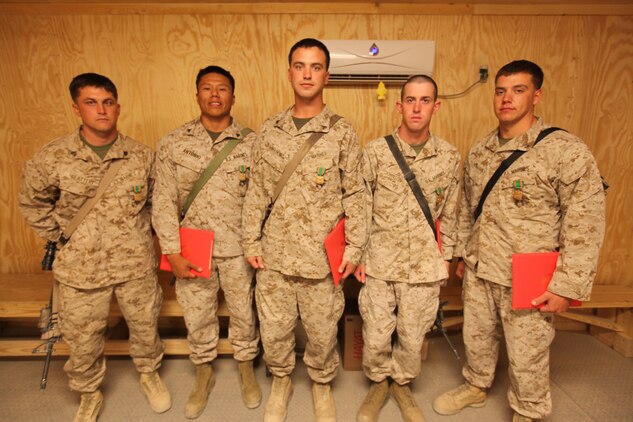 (From left to right) Sgt. Wesley M. Slattery, Cpl. Nalton B. Antonio, Cpl. Wayne G. Watkins, Lance Cpl. Benjamin J. Johnson and Lance Cpl. Ryan M. Williams, heavy equipment operators with 7th Engineer Support Battalion, 1st Marine Logistics Group (Forward), were presented the Navy and Marine Corps Achievement Medals by the 1st MLG (FWD) commanding general, Brig. Gen. Charles L. Hudson, May 25. Five Marines from 7th ESB were awarded Names for their ‘heroic actions’ in helping contain a fire at the Supply Management Unit lot on Camp Leatherneck, Afghanistan, May 16. The cause of the fire is under investigation.