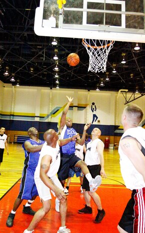 Osmond Shortt, Da FAM point guard, scores the last two points of the game with two seconds left on the clock during the intramural basketball game at IronWorks Gym, May 25.