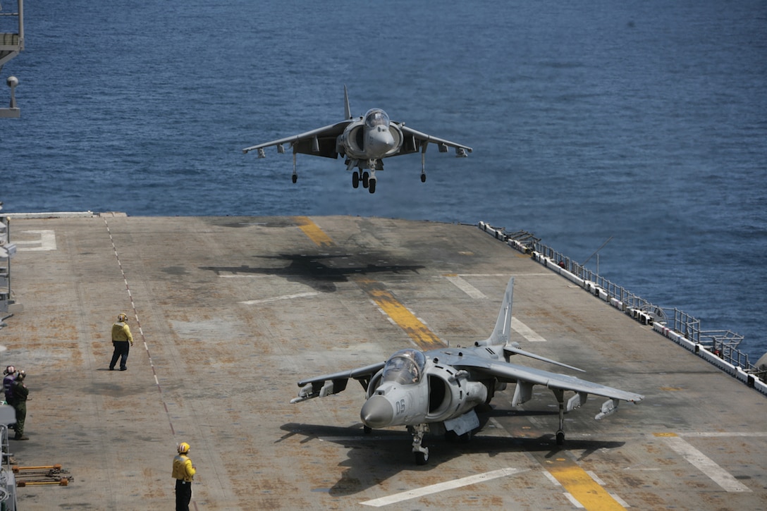 Capt. Dan “Fister” Fiust, Marine Attack Squadron 513 pilot, lands behind Capt. Jon “Beast” Bearce, VMA-513 pilot, aboard the USS Bonhomme Richard off the coast of San Clemente Island, Calif., May 26, 2010. The squadron supported the first Exercise Dawn Blitz, an exercise that affords Marines and sailors an opportunity to practice large-scale amphibious assault operations that combine long-range support and close-air support over a two-week period.