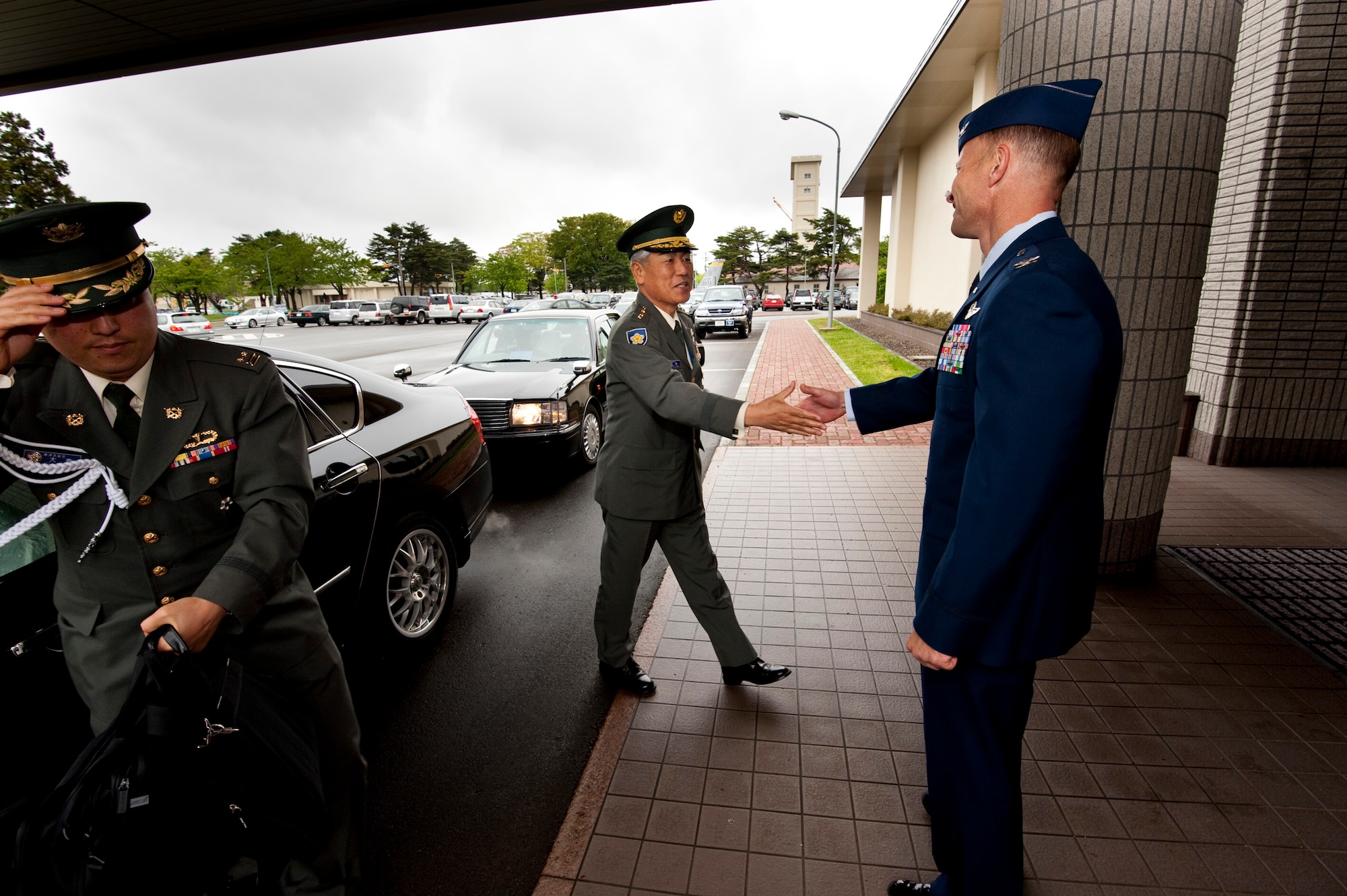 MISAWA AIR BASE, Japan -- Col. RC Craig, 35th Fighter Wing vice commander, greets Japanese Ground Self-Defense Force Gen. Ryoichi Oriki, Self-Defense Force chief of staff, outside the collocated club May 27. General Oriki visited the 35th Fighter Wing with Lt. Gen. Edward Rice Jr., U.S. Forces Japan and 5th Air Force commander. (U.S. Air Force photo/Staff Sgt. Samuel Morse)