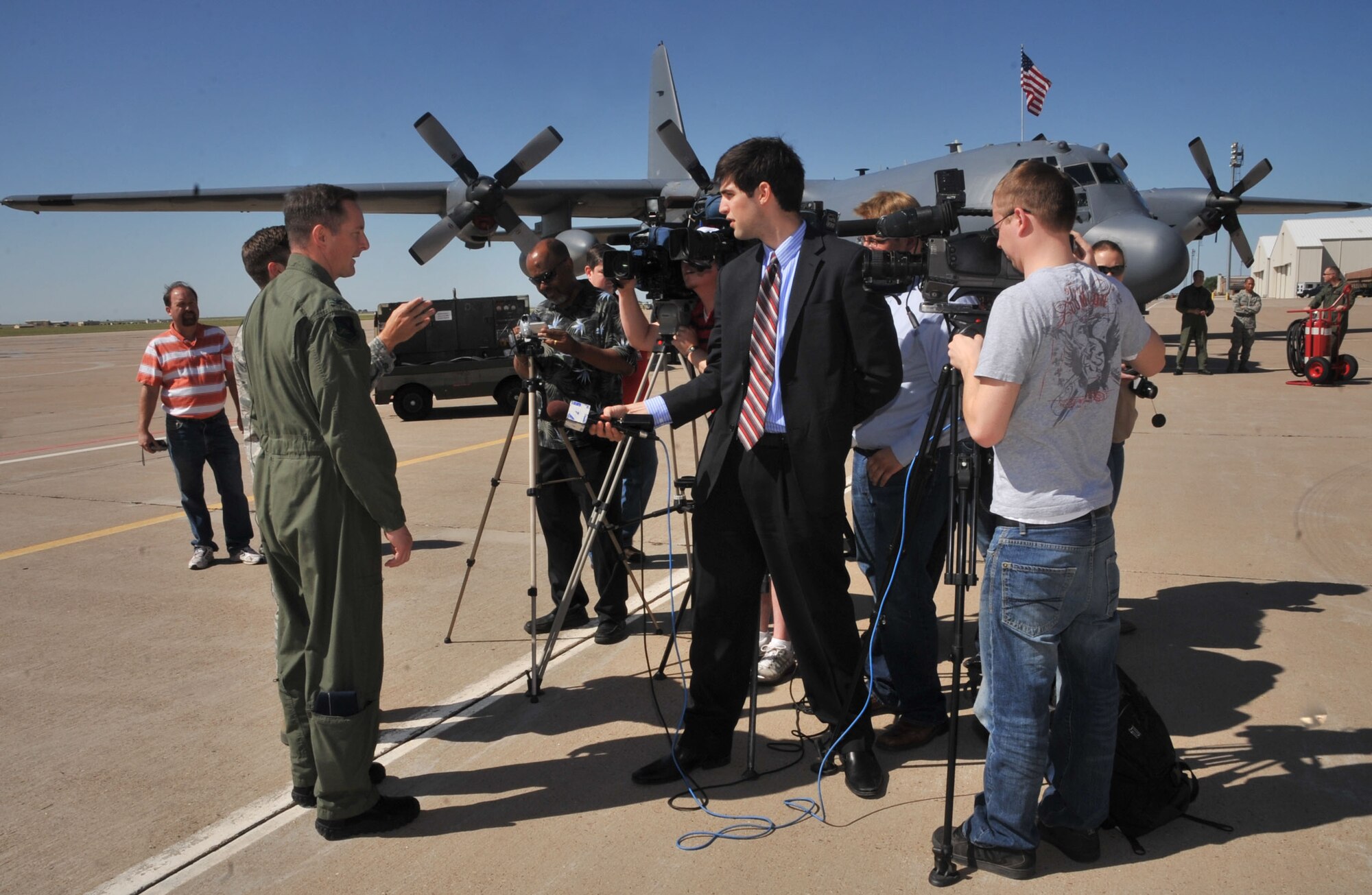 Col. Stephen Clark, 27th Special Operations Wing commander, answers questions from news reporters about the wing, its mission, aircraft and base growth during a media day, May 26. Local area television, radio and newspaper reporters toured Cannon Air Force Base, N.M, for a first-hand look at the changes to the base since it became an Air Force Special Operations Command wing in 2007. (U.S. Air Force photo by Airman 1st Class Maynelinne De La Cruz) 