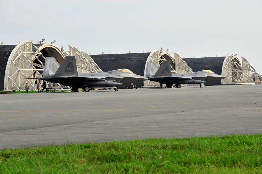 F-22 Raptors park on the ramp after landing at Kadena Air Base, Japan, May 27. The aircraft are deployed from Holloman Air Force Base, NM as part of an air expeditionary force rotation.   (U.S. Air Force photo/Senior Airman Amanda Grabiec)      