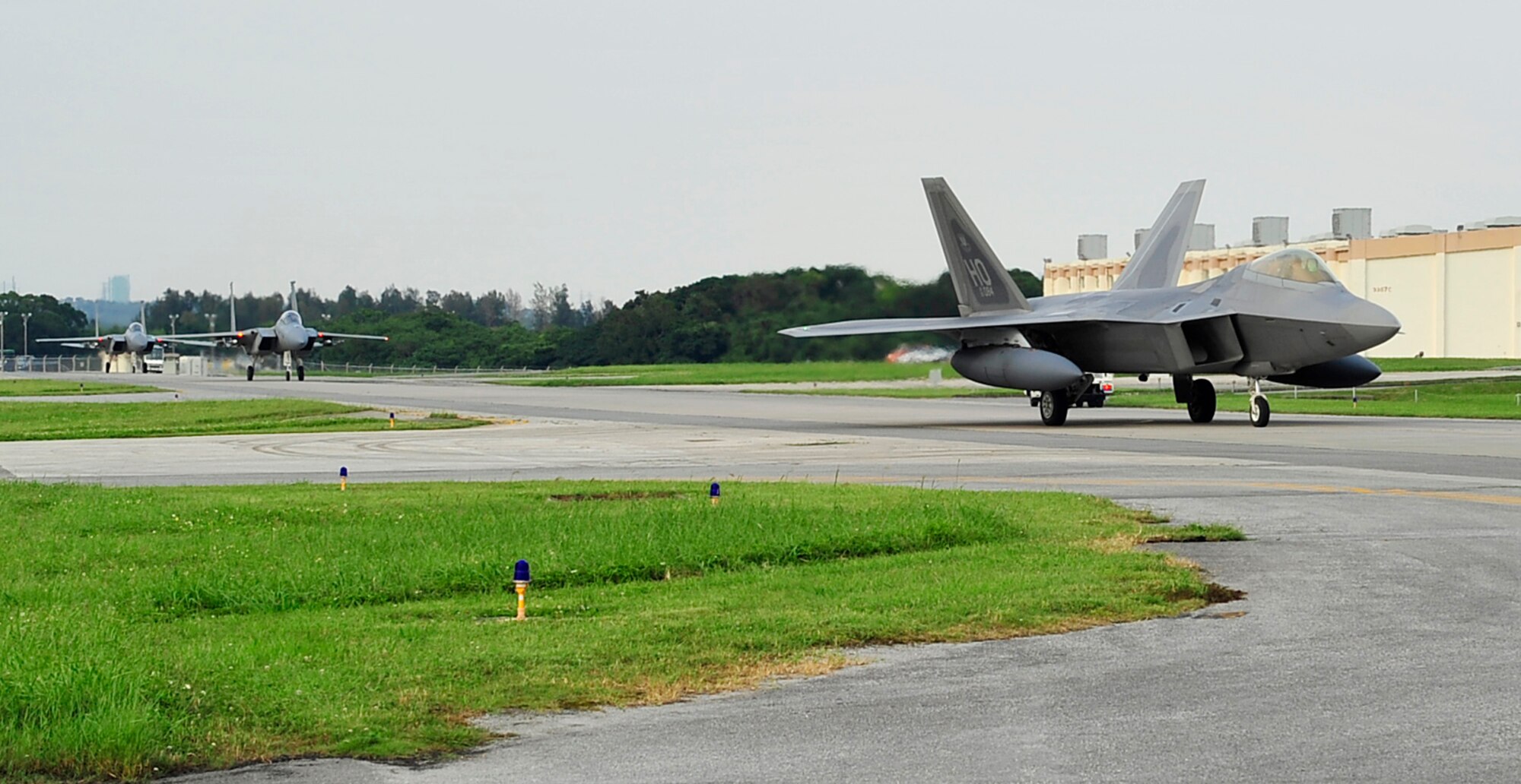 F-22 Raptors taxi down the runway of Kadena Air Base, May 27. The aircraft are deployed from Holloman Air Force Base, NM as part of an air expeditionary force rotation.  (U.S. Air Force photo/Senior Airman Amanda Grabiec)  