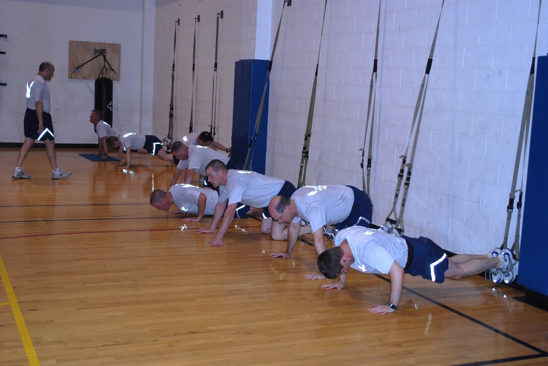 The commanders and chiefs of Sheppard Air Force Base, Texas, attack their weekly Combat Fit physical fitness session which is done every Wednesday morning at the Pitsenbarger gym at Sheppard May 26, 2010.  Sheppard's Combat Fit is a circuit-training program designed by HAWC fitness professionals to strengthen core muscles and build an overall stronger body.  (U.S. Air Force photo/Tech. Sgt. Vernon Cunningham)