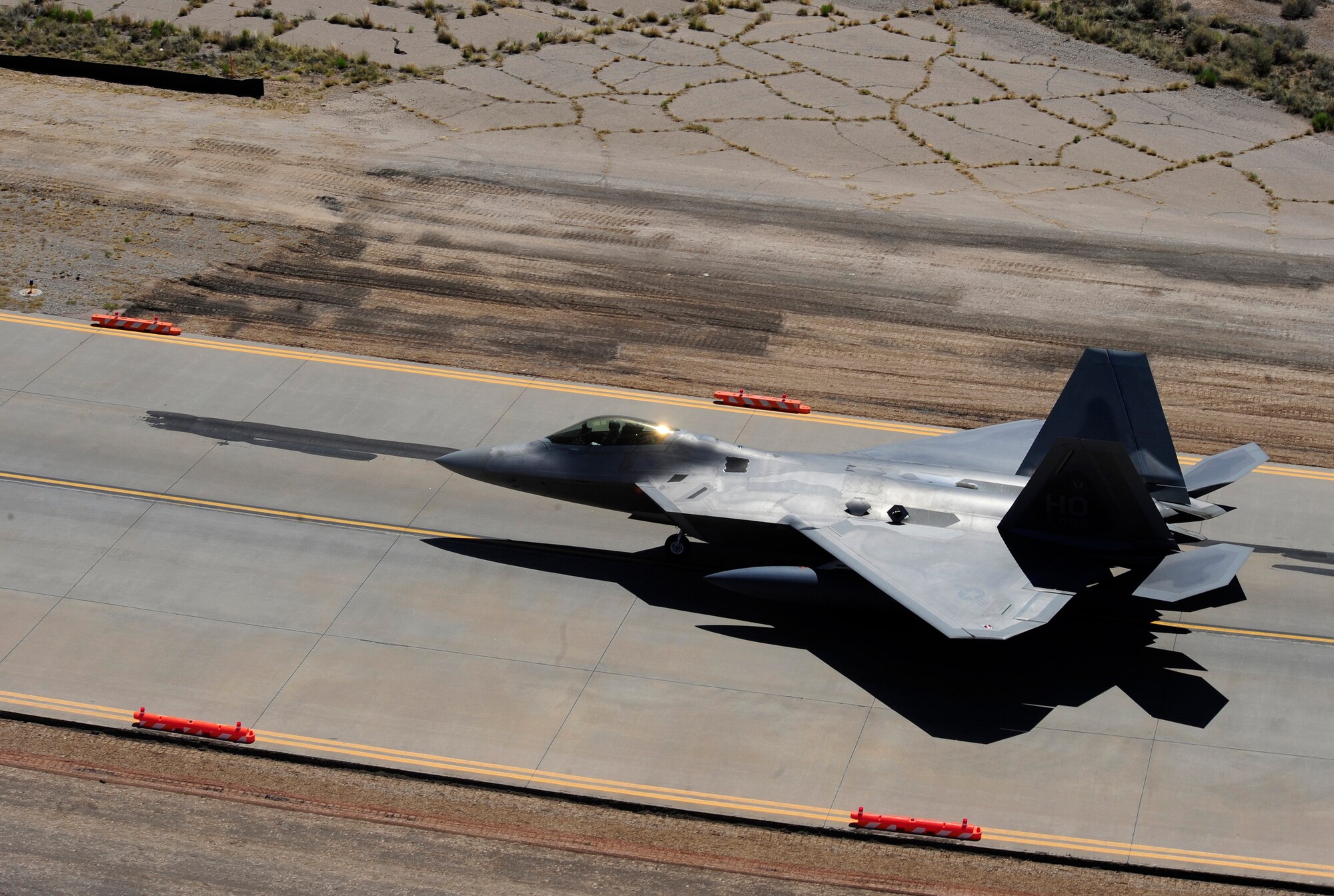 HOLLOMAN AIR FORCE BASE, N.M. -- An F-22 Raptor takes off from Holloman Air Force Base May 24, 2010. Members of Team Holloman and 12 Raptors deployed to Kadena Air Base, Japan, as part of continuing force posture adjustments to address worldwide requirements. The United States continues to deploy additional forces throughout the Western Pacific as part of U.S. Pacific Command’s Theater Security Package. (U.S. Air Force photo by Senior Airman Tiffany Trojca / Released)
