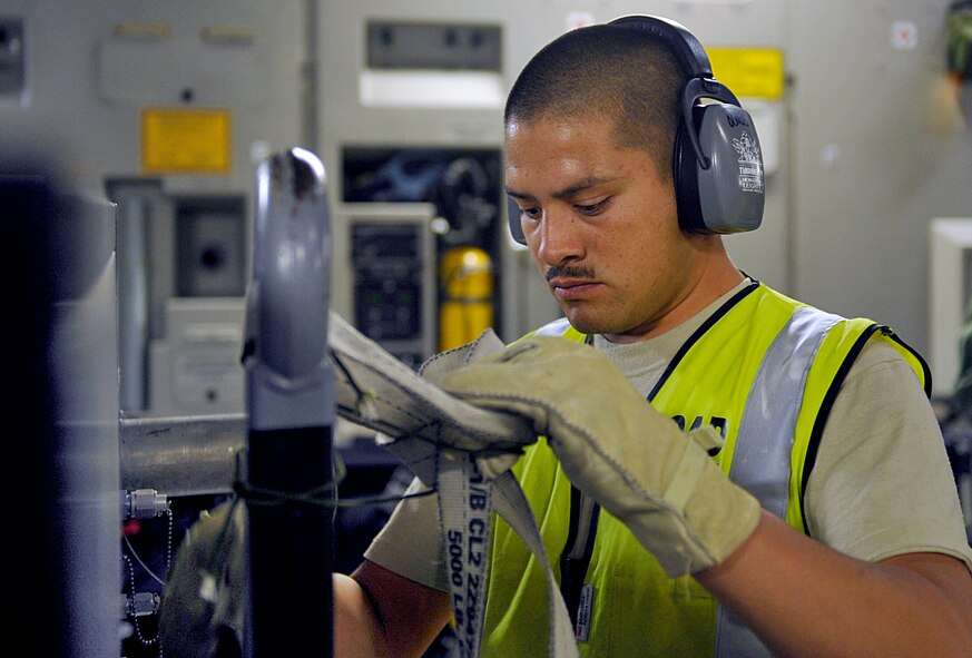 HOLLOMAN AIR FORCE BASE, N.M. -- A load team member secures a generator onto a C-17 Globemaster from McChord Air Force Base, Wash., May 22, 2010, in support of a recent deployment to Kadena Air Base, Japan. Team Holloman members deployed in support of U.S. Pacific Command's Theater Security Package. As part of continuing force posture adjustments to address worldwide requirements, the United States Department of Defense continues to deploy additional forces throughout the Western Pacific. (U.S. Air Force photo by Staff Sgt. Anthony Nelson Jr. / Released)