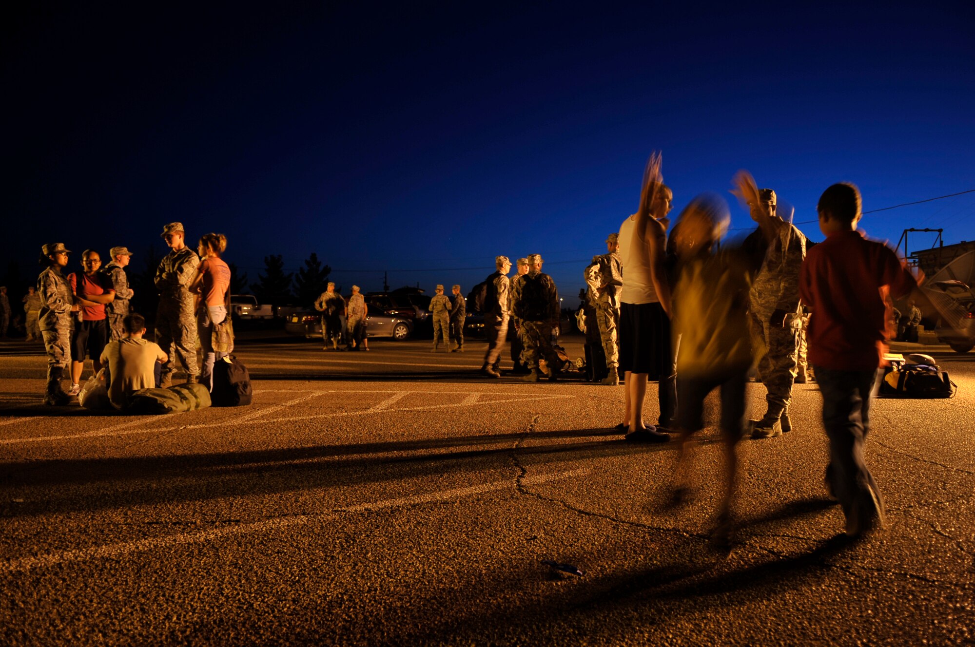 HOLLOMAN AIR FORCE BASE, N.M. -- Members of the 49th Maintenance Group spend time with family and friends May 21, 2010, before deploying to Kadena Air Base, Japan. Twelve F-22 Raptors deployed from Holloman to Kadena AB along with approximately 250 Airmen. As part of continuing force posture adjustments to address worldwide requirements, the United States continues to deploy additional forces throughout the Western Pacific as part of U.S. Pacific Command's Theater Security Package. This is the latest example of the flexibility U.S. forces have to meet their ongoing commitments and security obligations throughout the Pacific region. (U.S. Air Force photo by Airman 1st Class Joshua Turner / Released)
