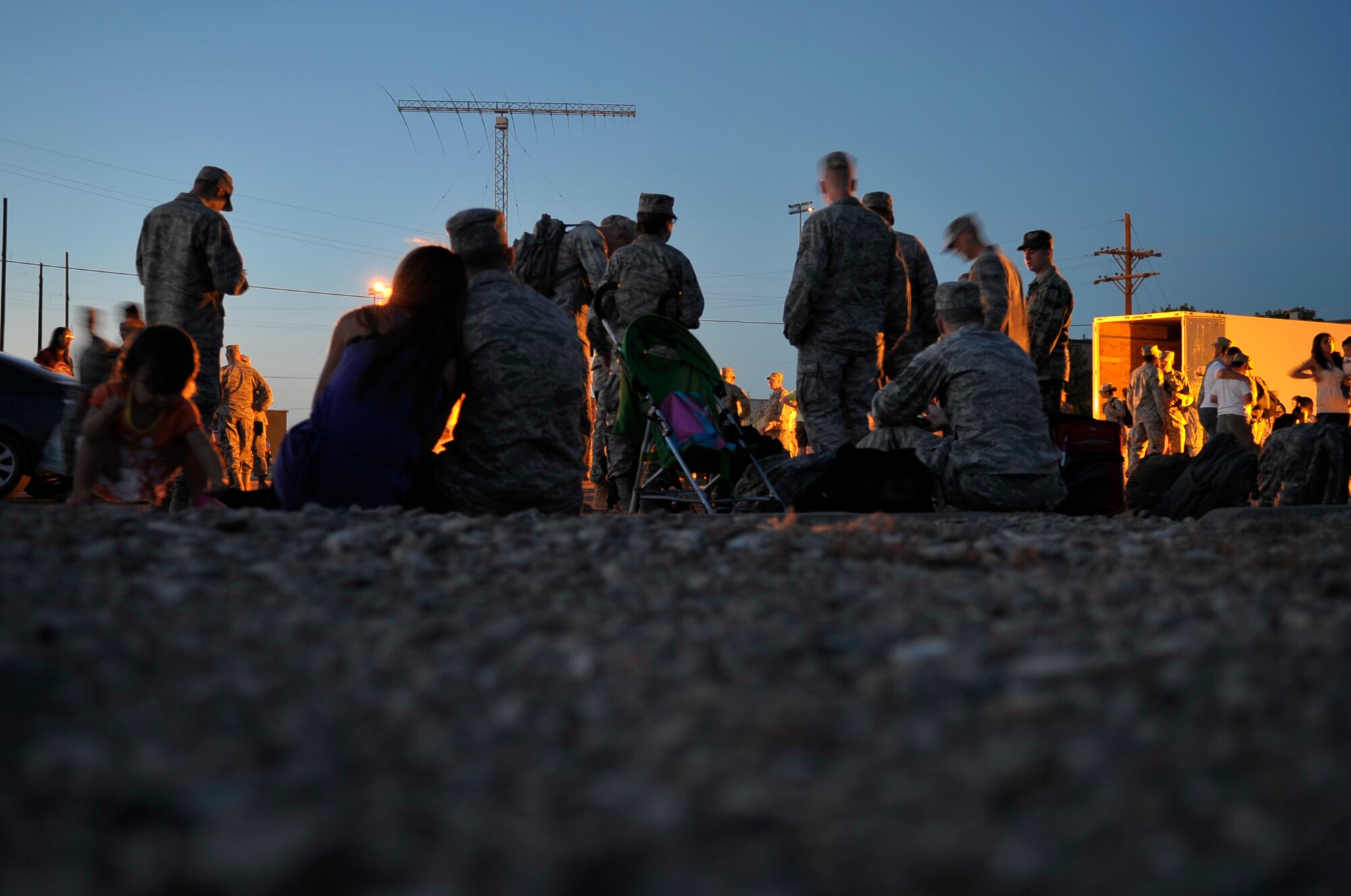 HOLLOMAN AIR FORCE BASE, N.M. -- Members of the 49th Maintenance Group spend time with their family and friends May 21, 2010, before deploying to Kadena Air Base, Japan. Twelve F-22 Raptors deployed from Holloman to Kadena AB along with approximately 250 Airmen. As part of continuing force posture adjustments to address worldwide requirements, the United States continues to deploy additional forces throughout the Western Pacific as part of U.S. Pacific Command's Theater Security Package. This is the latest example of the flexibility U.S. forces have to meet their ongoing commitments and security obligations throughout the Pacific region. (U.S. Air Force photo by Airman 1st Class Joshua Turner / Released)
