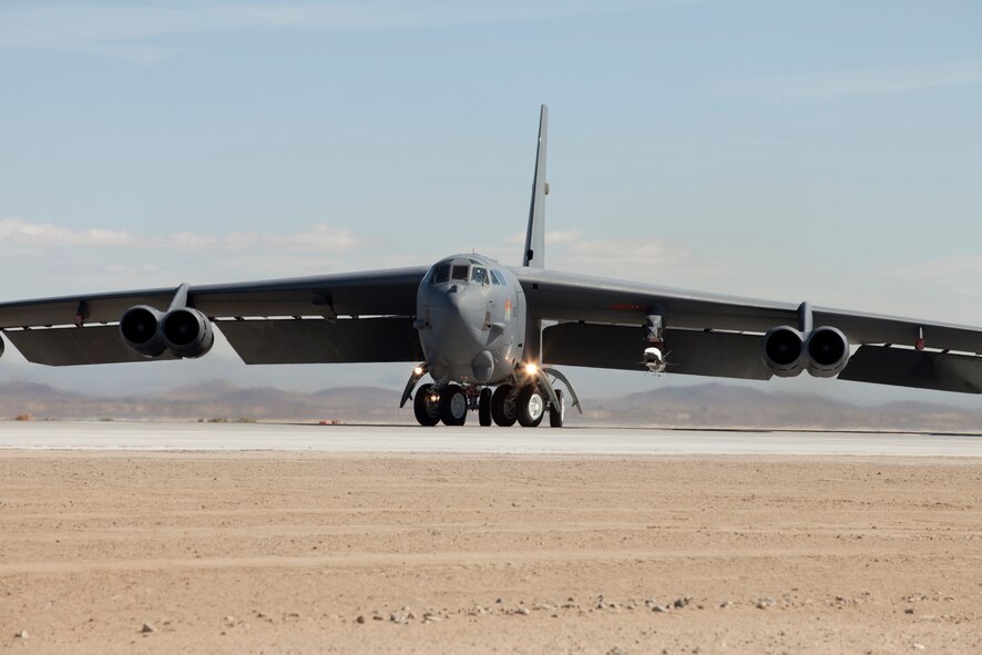 A B-52H carrying an X-51A WaveRider awaits takeoff at Edwards Air Force Base, Calif. May 26. The X-51A is an unmanned scramjet engine powered hypersonic flight demonstrator. (U.S. Air Force photo/Greg Davis) 
