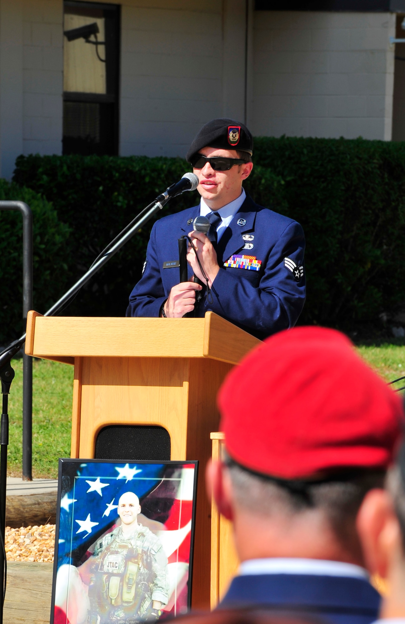 Senior Airman Mike Malarsie, 10th Air Support Operations Squadron Tactical Air Control Party member, speaks at a memorial cermeony held at the TACP schoolhouse here in honor of Senior Airman Brad Smith May 26, 2010.  While deployed in support of Operation Enduring Freedom, the Airmen and their unit encountered mulitple improvised explosive devices, which claimed Airman Smith's life and Airman Malarsies vision Jan. 3, 2010. (DoD photo by U.S. Air Force Senior Airman Sheila Devera)