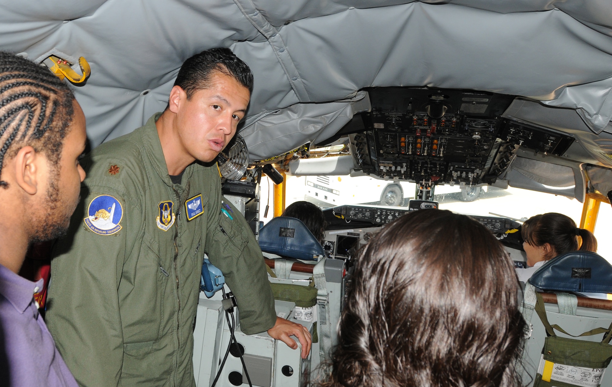 Maj. Paul Gomez, 756th Air Refueling Squadron, speaks with students from Cardozo Senior High School, Washington, DC, about the capabilities of the KC-135 Stratotanker, here May 26. 20 students from the high school toured Joint Base Andrews, Md., and also spoke with Airmen here from the 459th Air Refueling Wing and the 316th Wing about career opportunities in the Air Force Reserve and regular Air Force. (U.S. Air Force Photo/Staff Sgt. Steve Lewis)