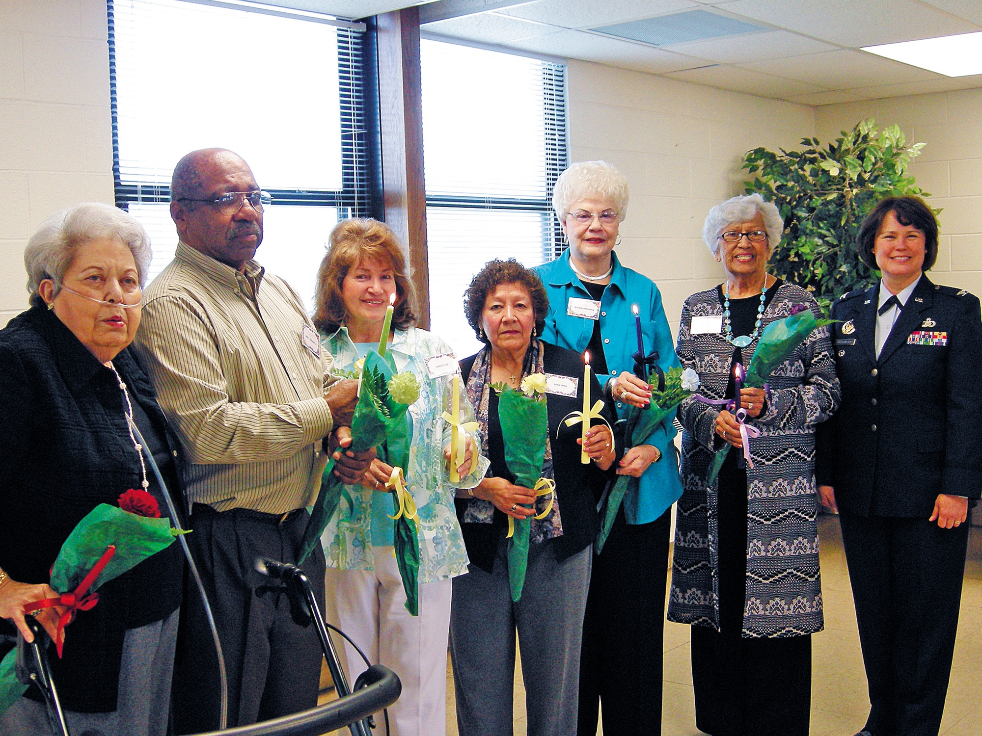 From left to right are: Mary Lou Cooper, chaplain; Jack Stewart, treasurer; Adela Cruz, recording secretary; Lexie Ortiz, corresponding secretary; Bobbie Heberling, vice president; Mary Garcia, president; and Col. Barbara J. Jorgensen, 377th Air Base Wing vice commander. Photo by Marie Vanover
