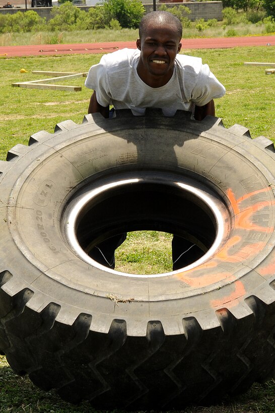 LANGLEY AIR FORCE BASE, Va. -- Senior Airman Ebo Yankson, 633d Force Support Squadron force management specialist, participates in a prism sports obstacle course May 21.  Prism Sports is a high intensity workout designed to develop an athlete’s power, movement biomechanics, and strength while also reducing the likelihood of non-contact injury by teaching correct exercise technique, increasing lean body mass, gaining strength and flexibility, correcting postural deviations, and developing the body’s metabolic energy system.  (U.S. Air Force Photo/Staff Sgt. Christina M. Styer)