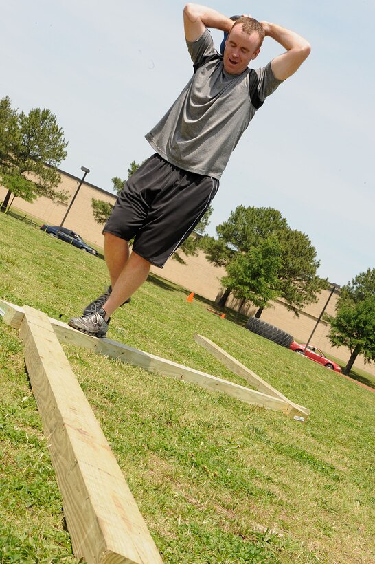 LANGLEY AIR FORCE BASE, Va. -- Senior Master Sgt. Bryan Shipman, 633d Force Support Squadron sports and fitness section chief, participates in a prism sports obstacle course May 21.  Prism Sports is a high intensity workout designed to develop an athlete’s power, movement biomechanics, and strength while also reducing the likelihood of non-contact injury by teaching correct exercise technique, increasing lean body mass, gaining strength and flexibility, correcting postural deviations, and developing the body’s metabolic energy system.  (U.S. Air Force Photo/Staff Sgt. Christina M. Styer)