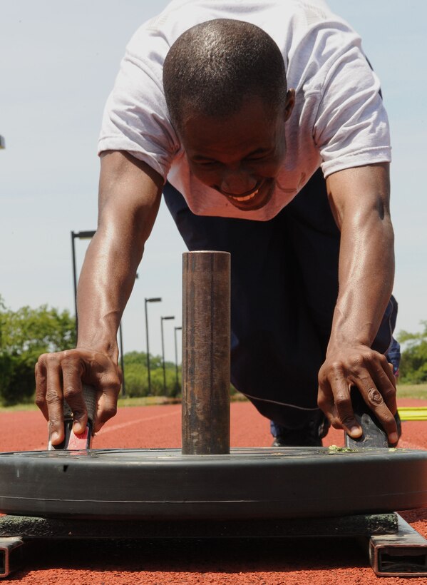 LANGLEY AIR FORCE BASE, Va. -- Senior Airman Ebo Yankson, 633d Force Support Squadron force management specialist, participates in a prism sports obstacle course May 21.  Prism Sports is a high intensity workout designed to develop an athlete’s power, movement biomechanics, and strength while also reducing the likelihood of non-contact injury by teaching correct exercise technique, increasing lean body mass, gaining strength and flexibility, correcting postural deviations, and developing the body’s metabolic energy system.  (U.S. Air Force Photo/Staff Sgt. Christina M. Styer)