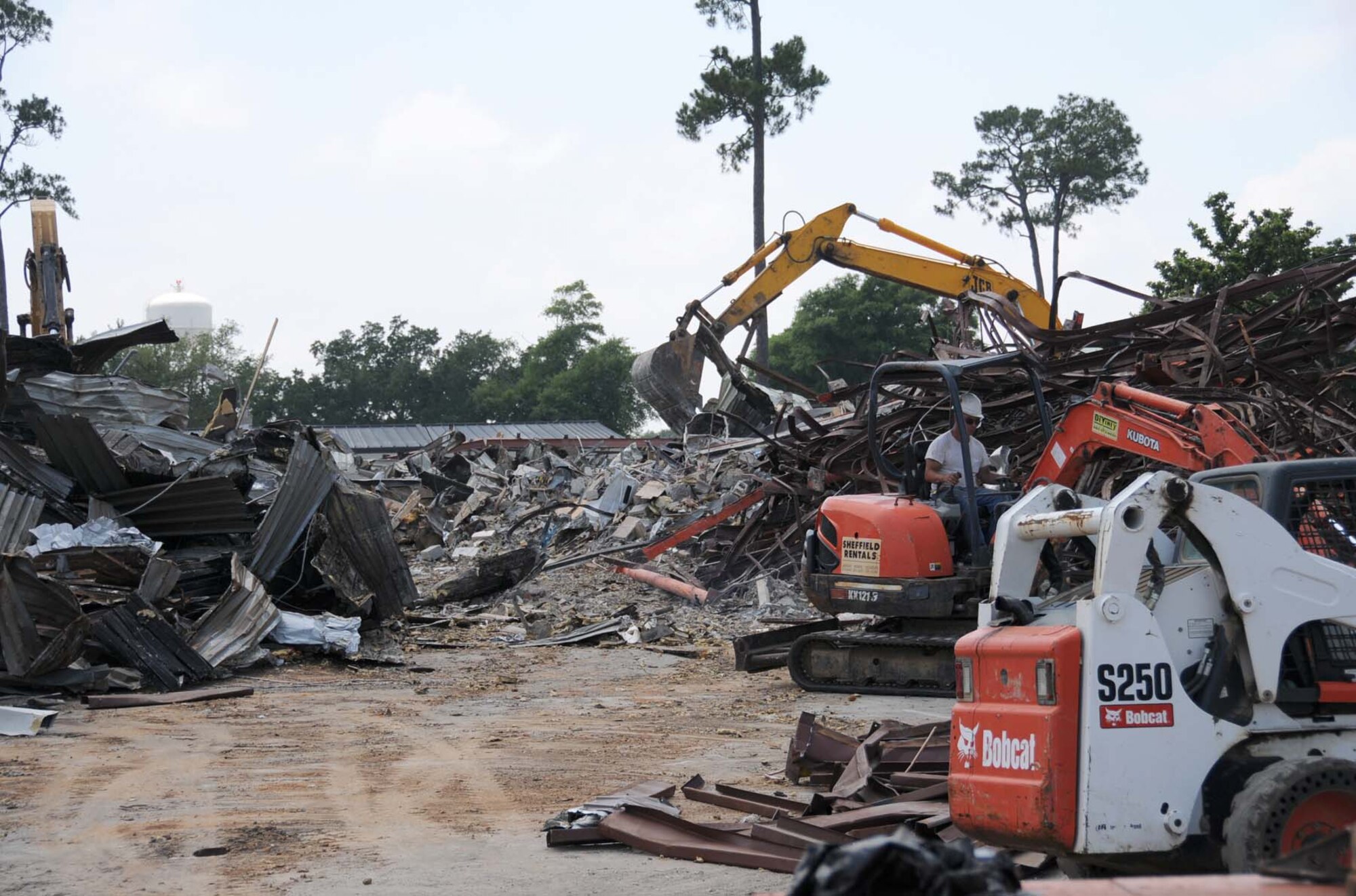 Last week, the temporary commissary on Meadows Drive was leveled.  The building, which once served as Keesler Community Center and enlisted club, was converted to a temporary commissary after Hurricane Katrina flooded the commissary on Larcher Boulevard in August 2005.  Now that the new commissary and base exchange are open, the area is being converted to employee parking and a loading dock for the base exchange.  Green space is planned between the street and the parking area. (U.S. Air Force photo by Kemberly Groue)
