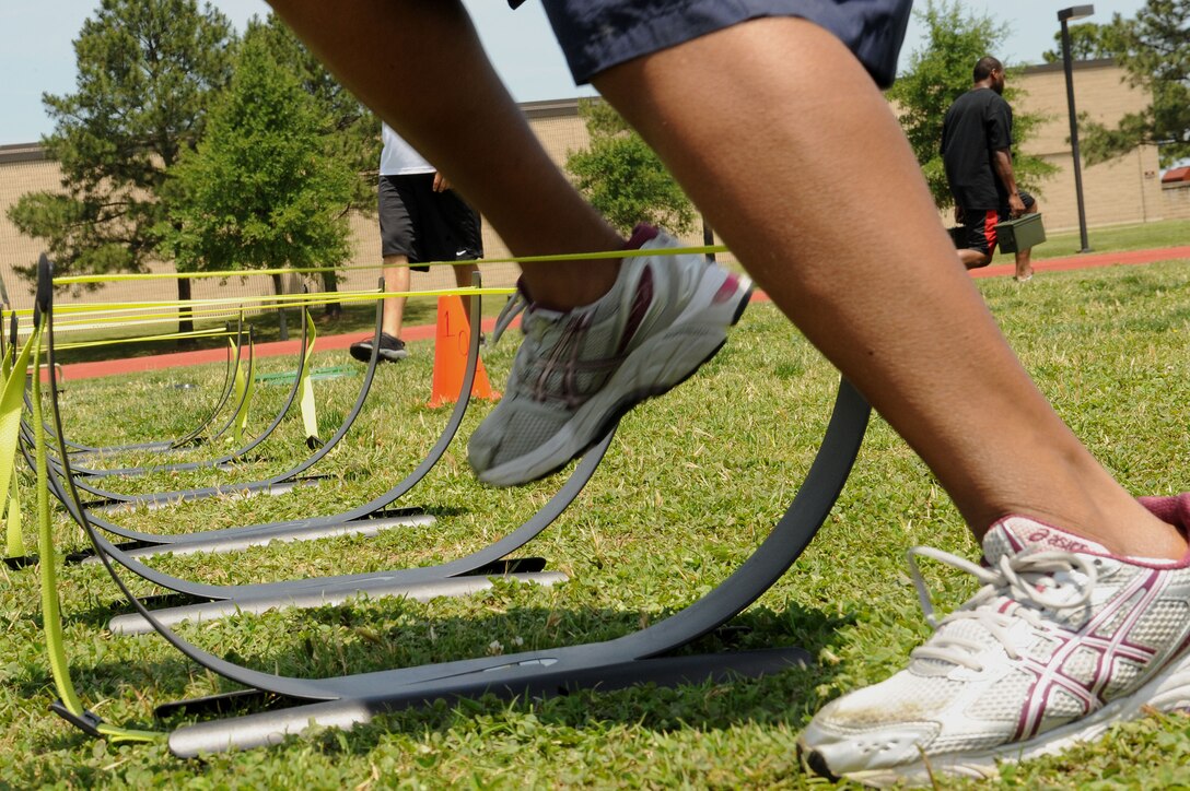LANGLEY AIR FORCE BASE, Va. -- Prism sports enthusiasts participate in an obstacle course May 21.  Prism Sports is a high intensity workout designed to develop an athlete’s power, movement biomechanics, and strength while also reducing the likelihood of non-contact injury by teaching correct exercise technique, increasing lean body mass, gaining strength and flexibility, correcting postural deviations, and developing the body’s metabolic energy system.  (U.S. Air Force Photo/Staff Sgt. Christina M. Styer)