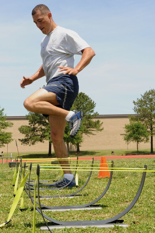 LANGLEY AIR FORCE BASE, Va. – Capt. Carlos Colon, 633d Force Support Squadron flight commander, participates in a prism sports obstacle course May 21.  Prism Sports is a high intensity workout designed to develop an athlete’s power, movement biomechanics, and strength while also reducing the likelihood of non-contact injury by teaching correct exercise technique, increasing lean body mass, gaining strength and flexibility, correcting postural deviations, and developing the body’s metabolic energy system.  (U.S. Air Force Photo/Staff Sgt. Christina M. Styer)