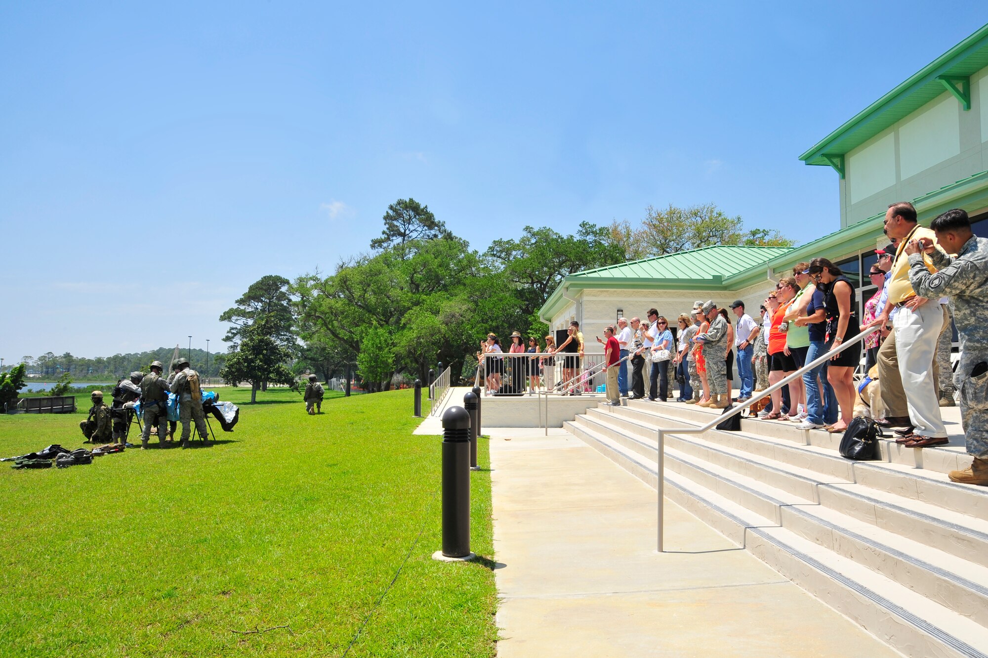 Airmen assigned to the 1st Special Operations Support Squadron, perfom a simulated life saving operation during a ground rescue operation demonstration at Hurlburt Field, Fla., May 20, 2010. Members of the Care Coaltion saw first hand how Air Force Special Operations Command  Airmen work together to successfully complete the mission, Hurlburt Field, Fla., May 20, 2010. The Care Coalition is an advocacy organization that works to enhance the quality of life of wounded USSOCOM service members and their families. (DoD photo by Senior Airman Sheila deVera)