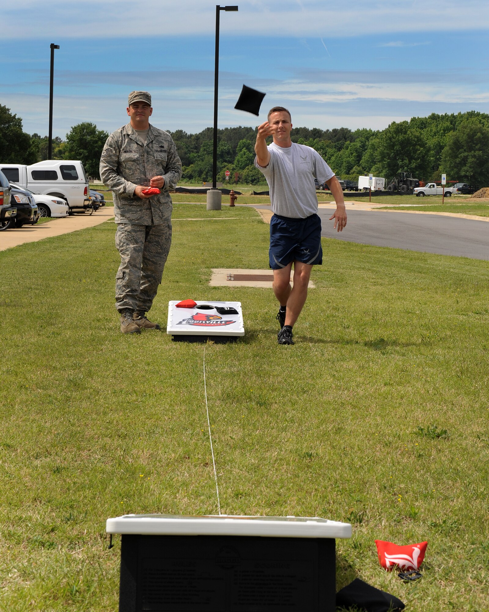 LANGLEY AIR FORCE BASE, Va. -- Lt. Col. Chris Cheetham, 480th Intelligence, Surveillance, and Reconnaissance Wing director of operations, tosses a bean bag  May 26.  Cornhole, along with other events were held as part of the 480th Intelligence, Surveillance, and Reconnaissance Wing Warrior Games.  (U.S. Air Force photo/Senior Airman Zachary Wolf)