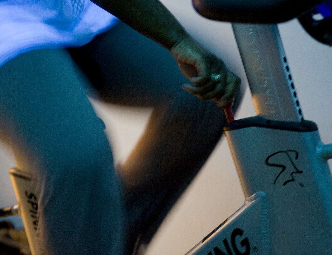 LANGLEY AIR FORCE BASE, Va. -- Sgt. Christine Johnson, 15th Intelligence Squadron intelligence analyst,increases her resistance during the 2010 Spinathon at the Shellbank Fitness Center May 22.  The event was held as part of Fitness Month and members who completed a minimum of two hours received a T-shirt.  (U.S. Air Force photo/Senior Airman Zachary Wolf) 
