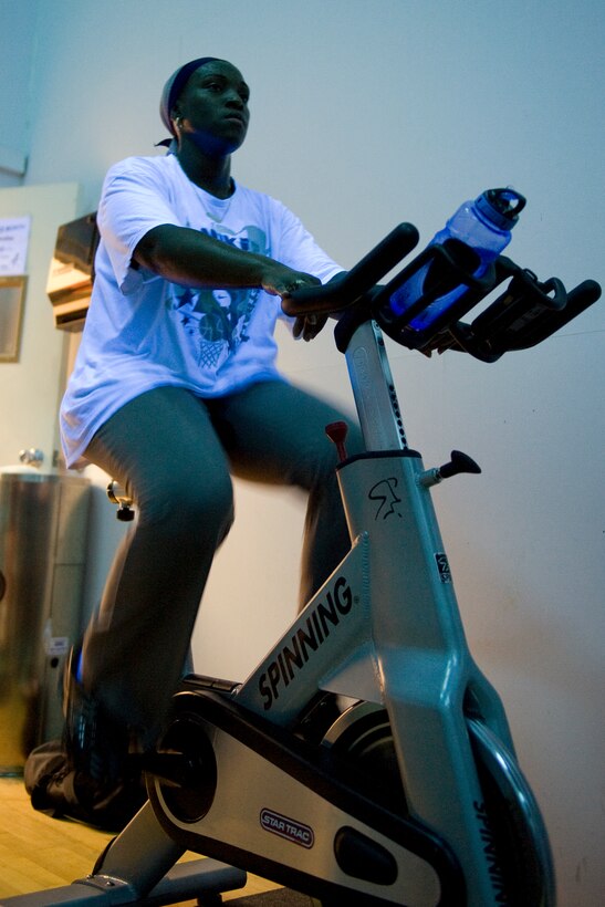 LANGLEY AIR FORCE BASE, Va. -- Staff Sgt. Christine Johnson, 15th Intelligence Squadron intelligence analyst, cycles during the 2010 Spinathon at the Shellbank Fitness Center May 22.  The event was held as part of Fitness Month and members who completed a minimum of two hours received a T-shirt.  (U.S. Air Force photo/Senior Airman Zachary Wolf) 