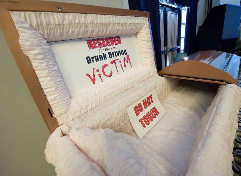 A coffin displayed at the Save a Life Tour, a National High Impact Alcohol Awareness Program at The Landings Club May 25. Dover Airmen were presented with a video of car crash victims, interviews from families and peers who shared stories about the loss of loved ones and a drinking and driving simulation experience. (U.S. Air Force photo/Jason Minto)