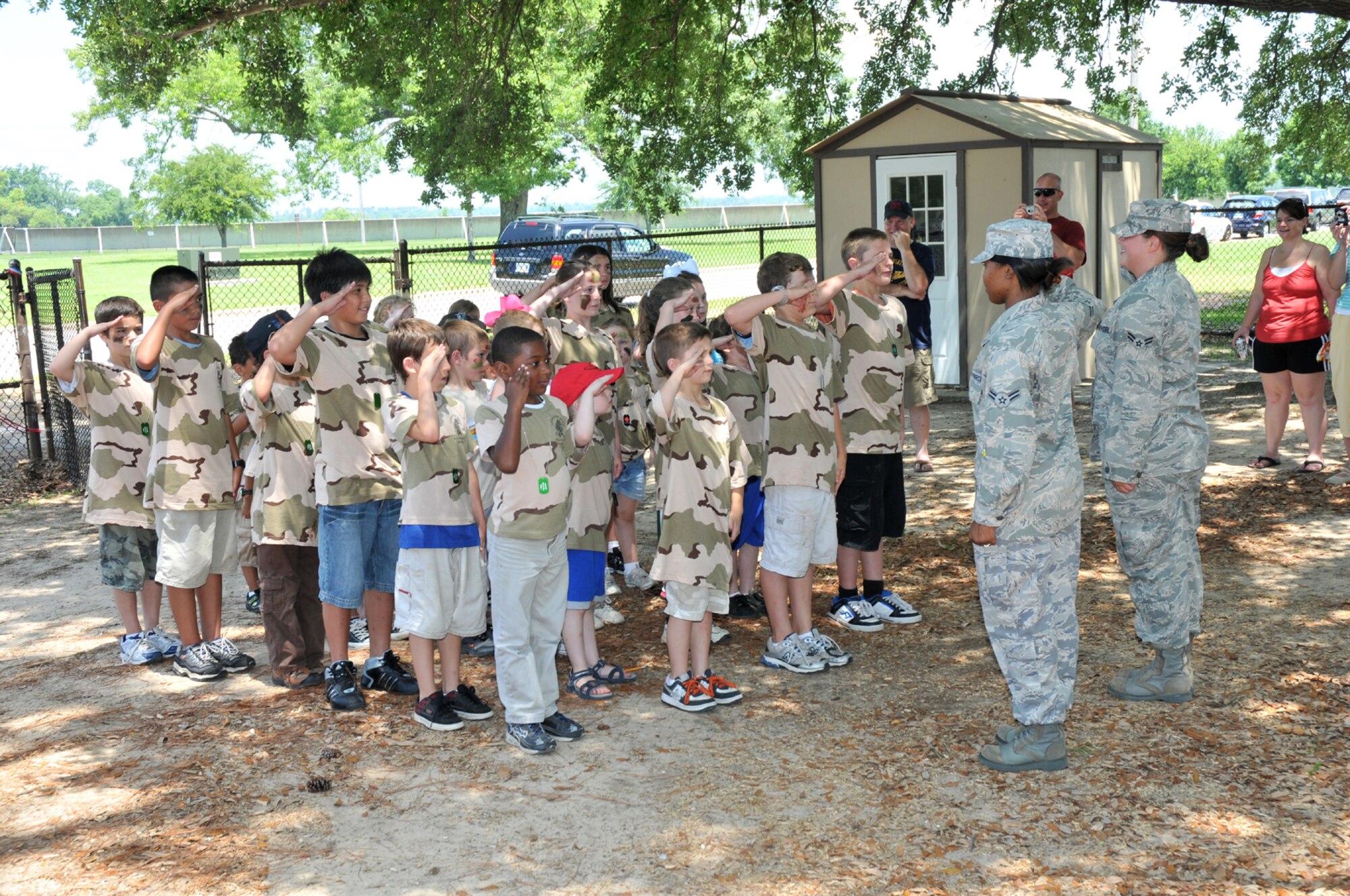 Participants salute at the end of drill competition during Saturday’s Operation Hero.  (U.S. Air Force photo by Adam Bond)