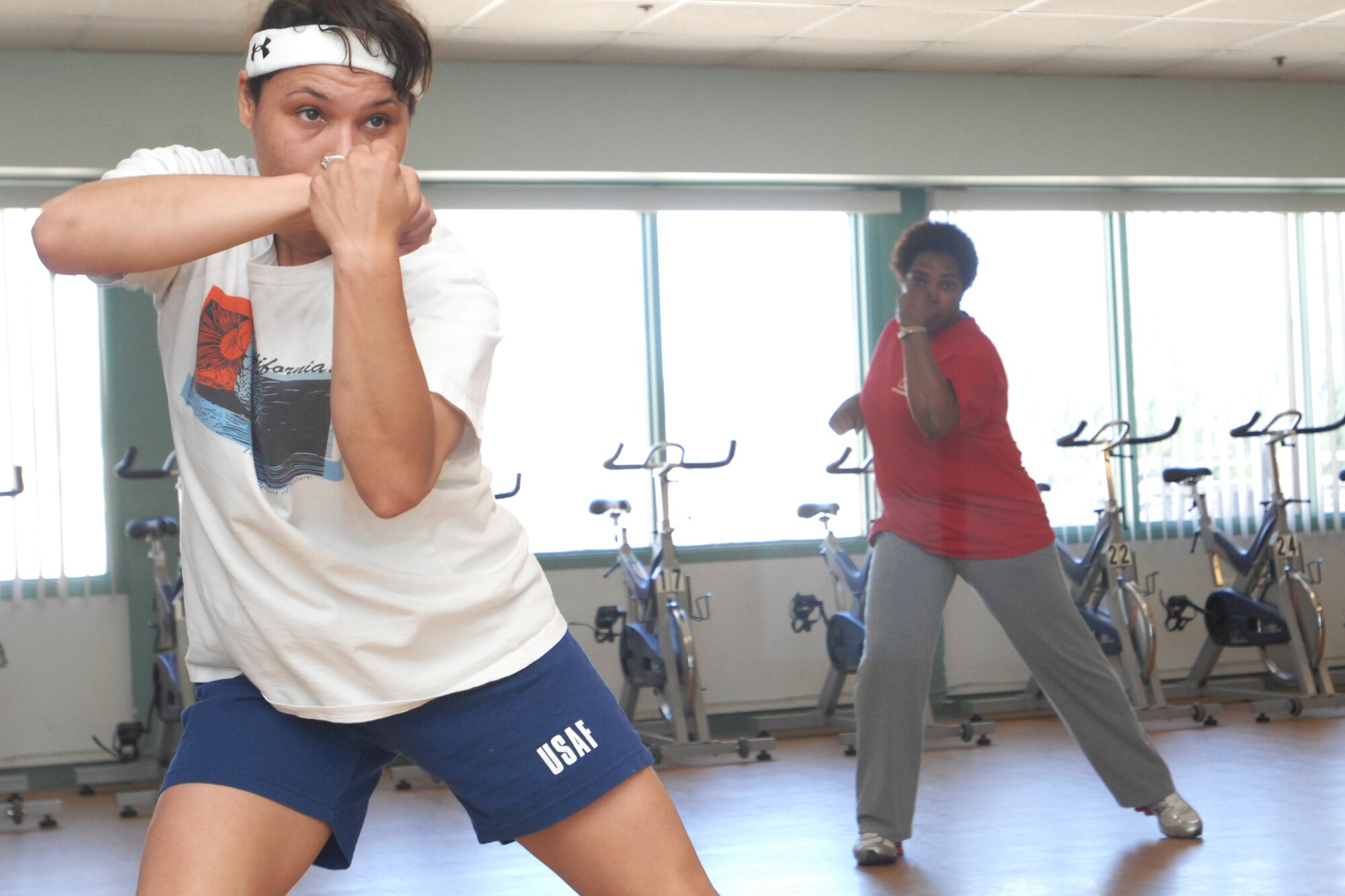 VANDENBERG AIR FORCE BASE, Calif. – Kim Brown, a military spouse, performs routine movements during a cardio kickboxing class at the Airman and Family Readiness Center here Tuesday, May 25, 2010. The class incorporates a cardio workout as well as sit-ups to build the abdominal core.  (U.S. Air Force photo/Senior Airman Christopher Hubenthal)