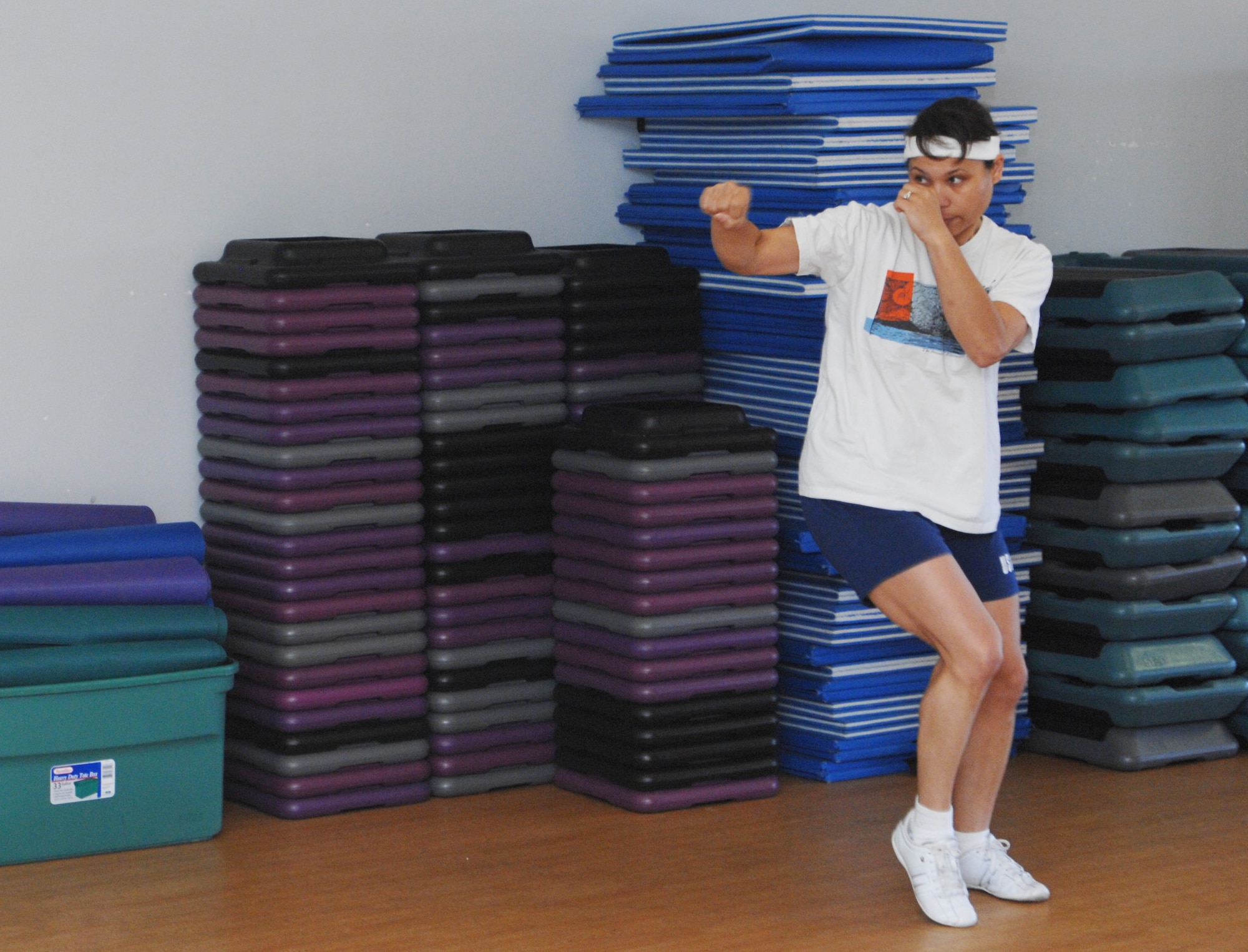 VANDENBERG AIR FORCE BASE, Calif. – Kim Brown, a military spouse, shadow boxes during a cardio  kickboxing class at the Airman and Family Readiness Center here Tuesday, May 25, 2010. Cardio kickboxing is offered every Tuesday and Thursday at noon. (U.S. Air Force photo/Senior Airman Christopher Hubenthal)