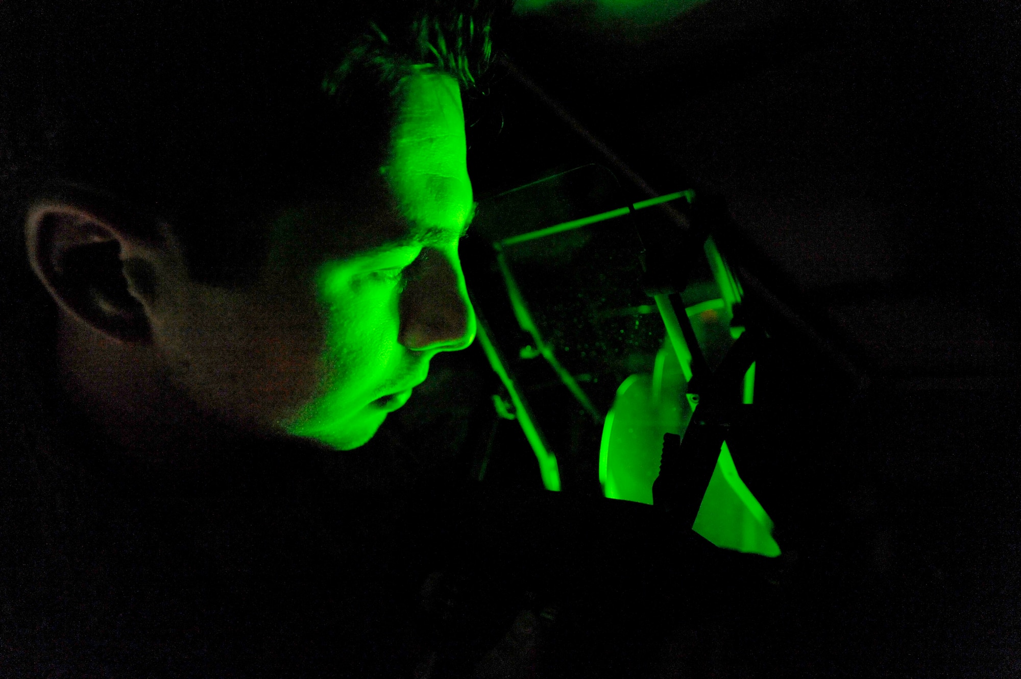 Senior Airman Keiron Legg checks the night mode on a C-17 Globemaster III heads-up display unit May 25, 2010, at Joint Base Charleston, S.C. Airman Legg is a test station and components journeyman with the 437th Maintenance Squadron. (U.S. Air Force photo/James M. Bowman)