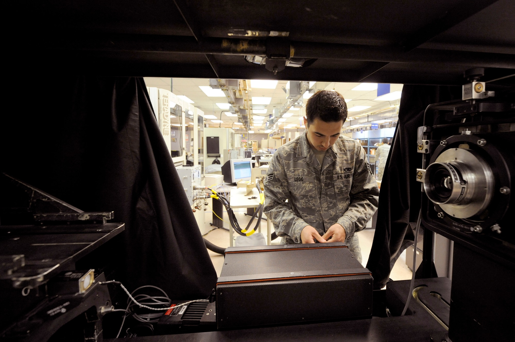 Senior Airman Keiron Legg sets up a display unit test set to run an operations test on a C-17 Globemaster III heads-up display unit May 25, 2010, at Joint Base Charleston, S.C. Airman Legg is a test station and components journeyman with the 437th Maintenance Squadron. (U.S. Air Force photo/James M. Bowman)
