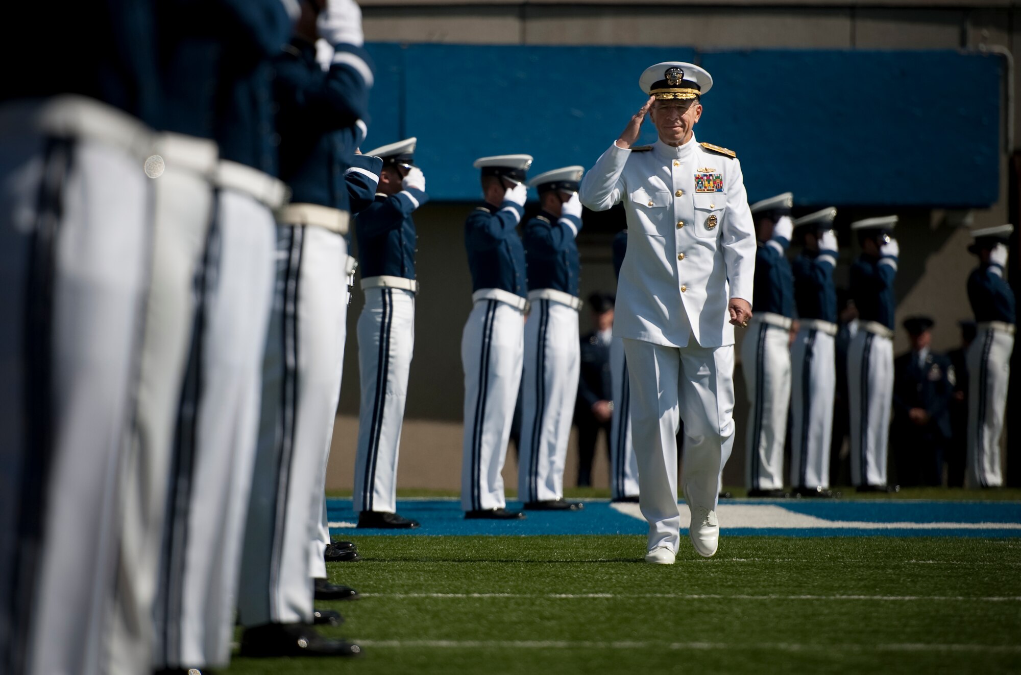 Navy Adm. Mike Mullen, chairman of the Joint Chiefs of Staff, arrives at the U.S. Air Force Academy's Falcon Stadium for Graduation 2010 ceremony May 26. Admiral Mullen is the first Joint Chiefs chairman to deliver the Air Force Academy's commencement address. (U.S. Navy photo/Mass Communication Specialist Chad J. McNeeley)