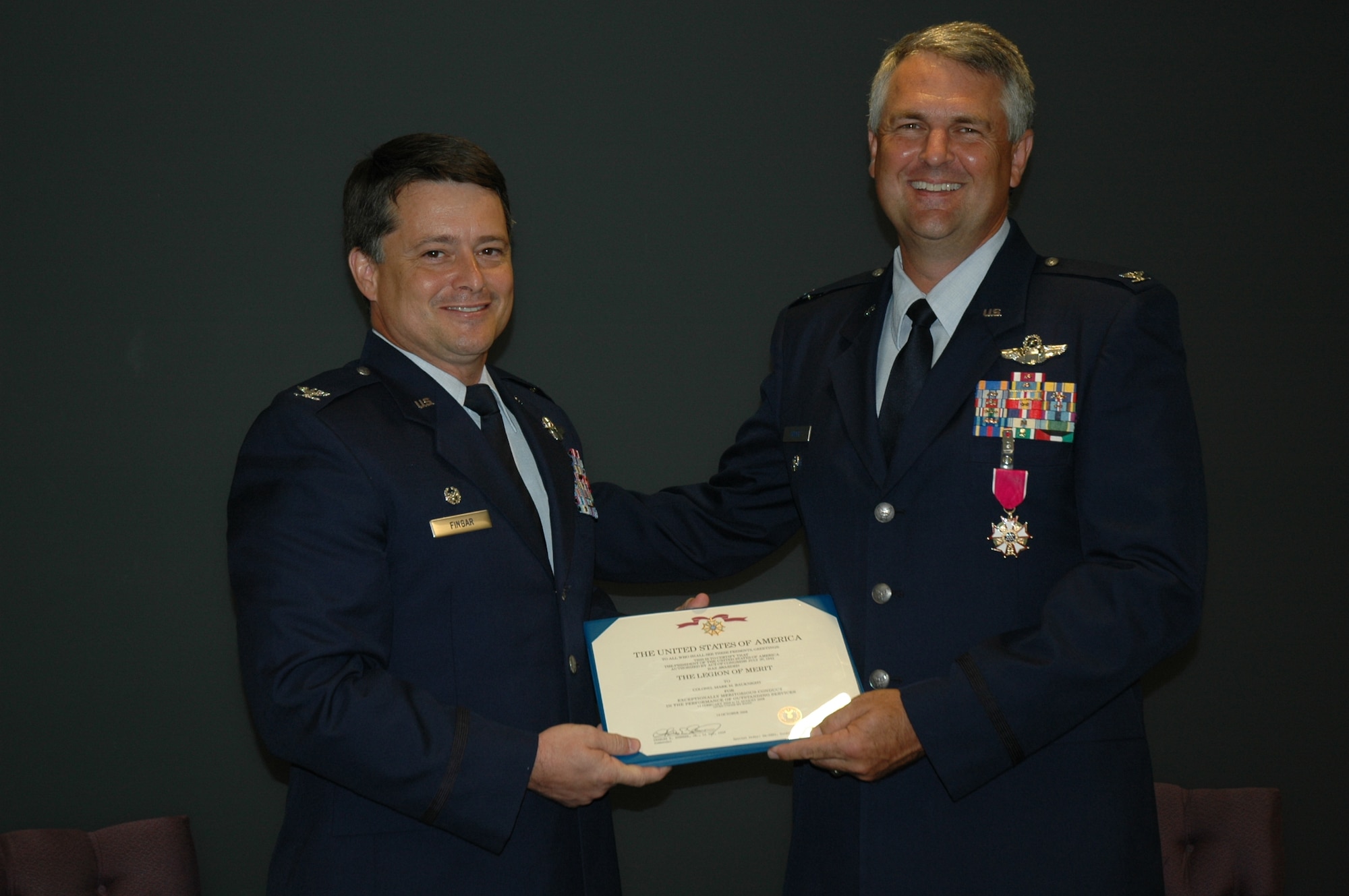 Colonel Mike Speer, outgoing vice commander, 315th Airlift Wing Charleston Air Force Base, S.C. recieved the Legion of Merit Award May 26 from Colonel Russ Fingar at the 315th AW headquaters building. Col. Speer retires after 26 years of service with Col. Fingar assuming the role of vice wing commander. (U.S. Air Force Photo/2nd Lt Joe Simms)