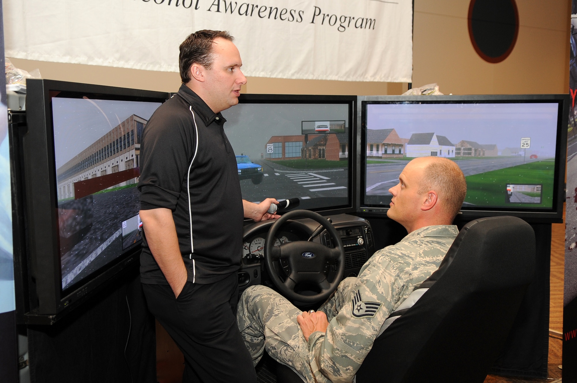 BUCKLEY AIR FORCE BASE, Colo. -- Staff Sgt. Jeffrey Fitzmorris, 460th Space Wing, gears up to "drive drunk" in the Save-a-Life Tour drunk driving simulator May 20. The Save-a-Life Tour offers individuals the chance to experience from a sober point of view the world of driving while under the influence. ( U.S. Air Force Photo by Airman 1st Class Marcy Glass )

