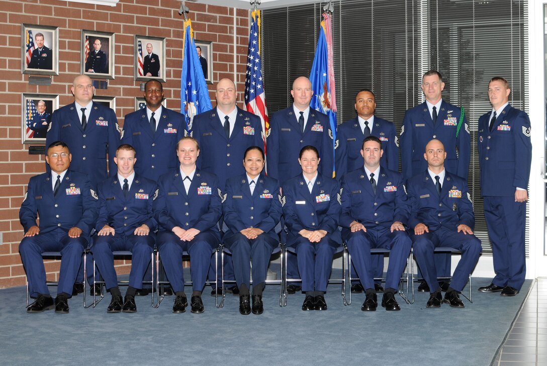 McGHEE TYSON AIR NATIONAL GUARD BASE, Tenn. -- NCO Academy Class 10-5, F-Flight, gathers at The I.G. Brown Air National Guard Training and Education Center here, May 3, 2010. L-R front row are Tech. Sgt. Juan J. Valle; Tech. Sgt. John T. Parker, III; Tech. Sgt. Audrey M. Gippe; Tech. Sgt. Jean S. Chabanne; Tech. Sgt. Diana E. Tamayo; Tech. Sgt. Justin M. Bartlow; Tech. Sgt. Anthony J. Schettino; (L-R back row) Tech. Sgt. Gordon M. Torrey; Tech. Sgt. Gerry L. Jones; Tech. Sgt. Micah S. Jobe; Tech. Sgt. Griffith R. Burdette; Tech. Sgt. Robert E. Roby, Jr.; Tech. Sgt. Terry L. Neff, Jr.; and Tech. Sgt. Derek Westfall, instructor. (U.S. Air Force photo by Master Sgt. Kurt Skoglund/Released)