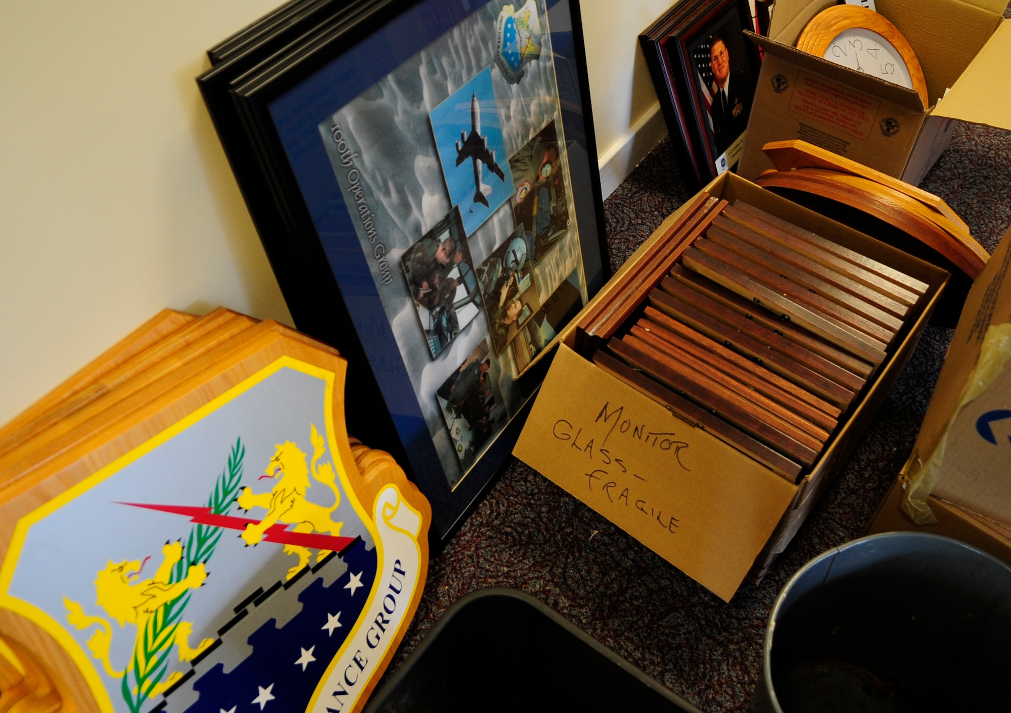 RAF MILDENHALL, England – Boxes of photos and stacks of picture frames are stacked in temporary piles along the walls waiting to be hung during the First Term Airmen’s Center move to Building 670, May 26.  (U.S. Air Force photo/Staff Sgt. Christopher L. Ingersoll)