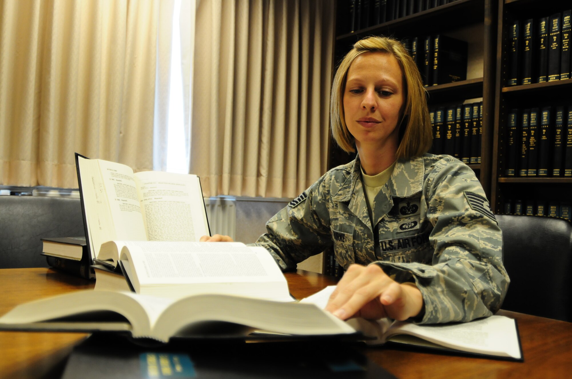 Tech. Sgt. Karin Burke, 48th Fighter Wing NCOIC of claims and legal assistance, conducts research for an attorney to aid them in advising a client with a tort claims May 19. A tort claim is a claim filed against the government for wrongful acts towards the individual. (U.S. Air Force photo/Airman 1st Class Lausanne Morgan)