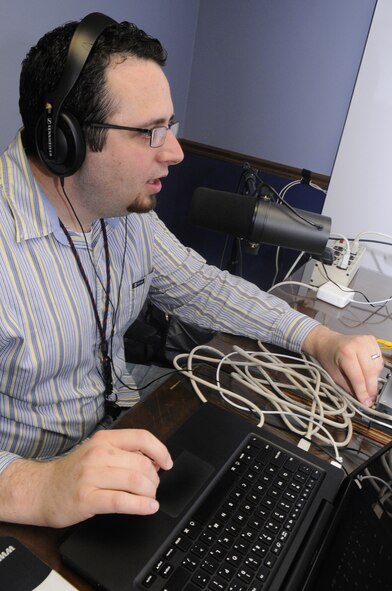 Mike Miller, producer of the Twila and Chuck Show, takes care of technical issues before a taping. U. S. Air Force photo by Sue Sapp