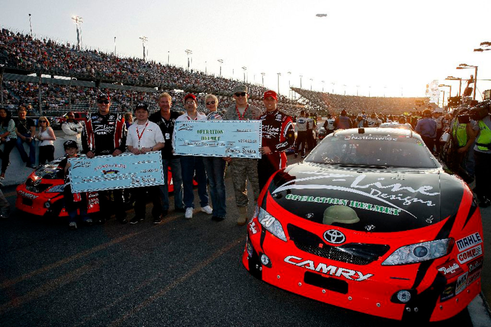 7 May, 2010, Darlington, South Carolina USA
Kyle Busch, Denny Hamlin and Jim and Monica Sexton with the Racing for Kids and Operation Helmet charities, each receiving for $25,000 from Z-Line Designs
Copyright 2010 Lesley Ann Miller, USA
LAT Photographic